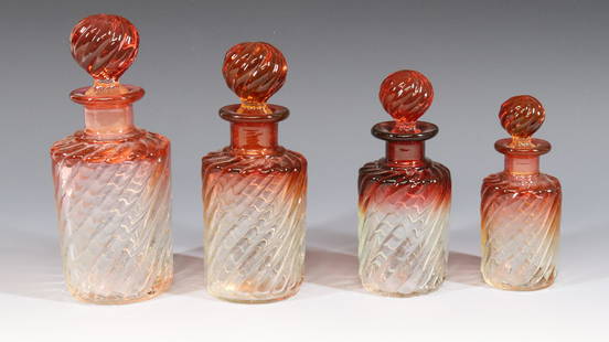 BACCARAT COLOGNE BOTTLES: (4) GRADUATED RUBINA SWIRL PATTERN BOTTLES GROUND STOPPERS AND BASES 5" TO 7" HEIGHT