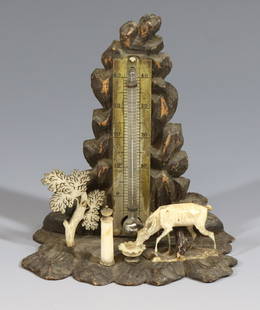 BLACK FOREST AND BONE THERMOMETER: CARVED WOOD BASE WITH CARVED BONE STAG AND ROMAN COLUMN AND BOWL WORKING 4"H X 3 1/2"