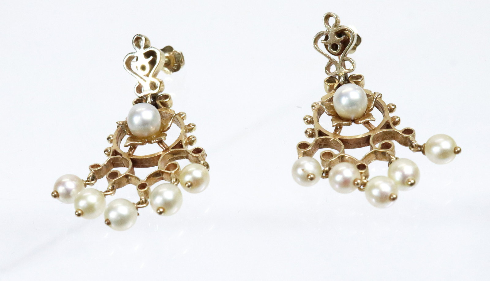 14K PEARL DROP EARRINGS: HAND WROUGHT FRENCH SETTINGS WITH CENTER PEARL AND FIVE PEARL DROPS PIERCED STYLE WITH SCREW BACKS 1 1/2" X 1" 5.1 DWT TOTAL WEIGHT