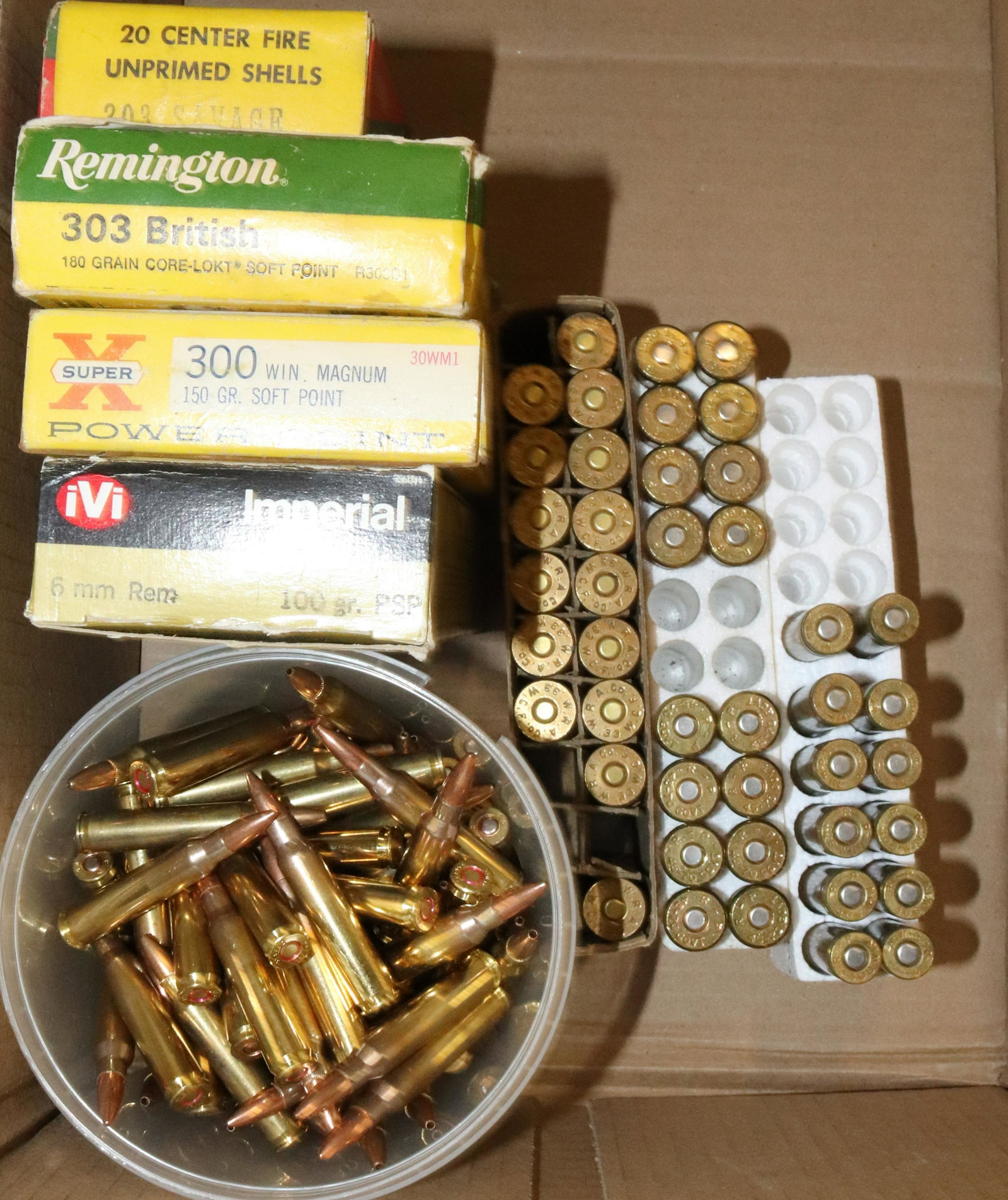 LOT OF VARIOUS AMMUNITION: 50+ ROUNDS OF 5.56 X 45. PRIMED CASINGS FOR 300 WINCHESTER MAGNUM AND 33WCF. (13) ROUNDS OF 303 BRITISH. 6MM BRASS CASINGS. 12 ROUNDS OF 308. 16 PRIMED 45-70 CASINGS