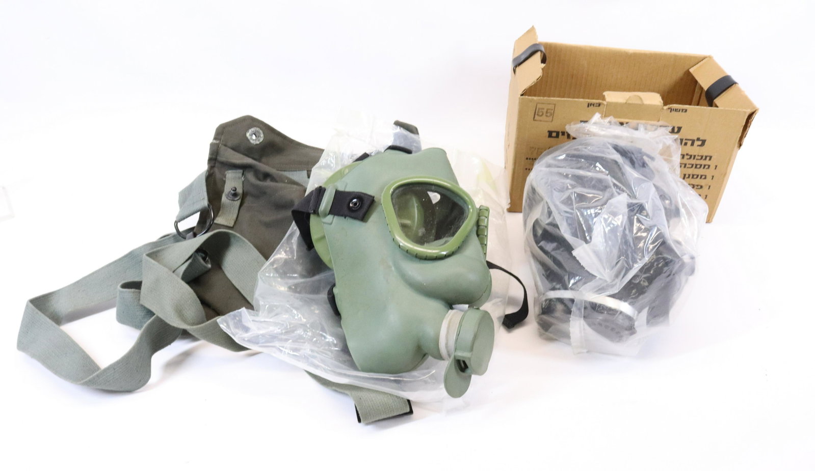 PAIR OF GAS MASKS: TWO MASKS ONE WITH CANVAS BAG.