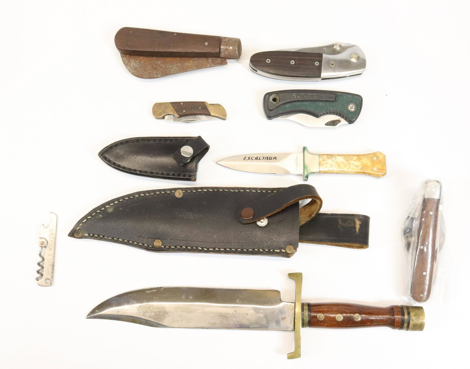 LOT OF KNIVES AND UTILITY TOOL: FOUR FOLDING KNIVES, CORKSCREW/BOTTLE OPENER, EXCALIBER KNIFE AND LARGE BOWIE STYLE KNIFE.