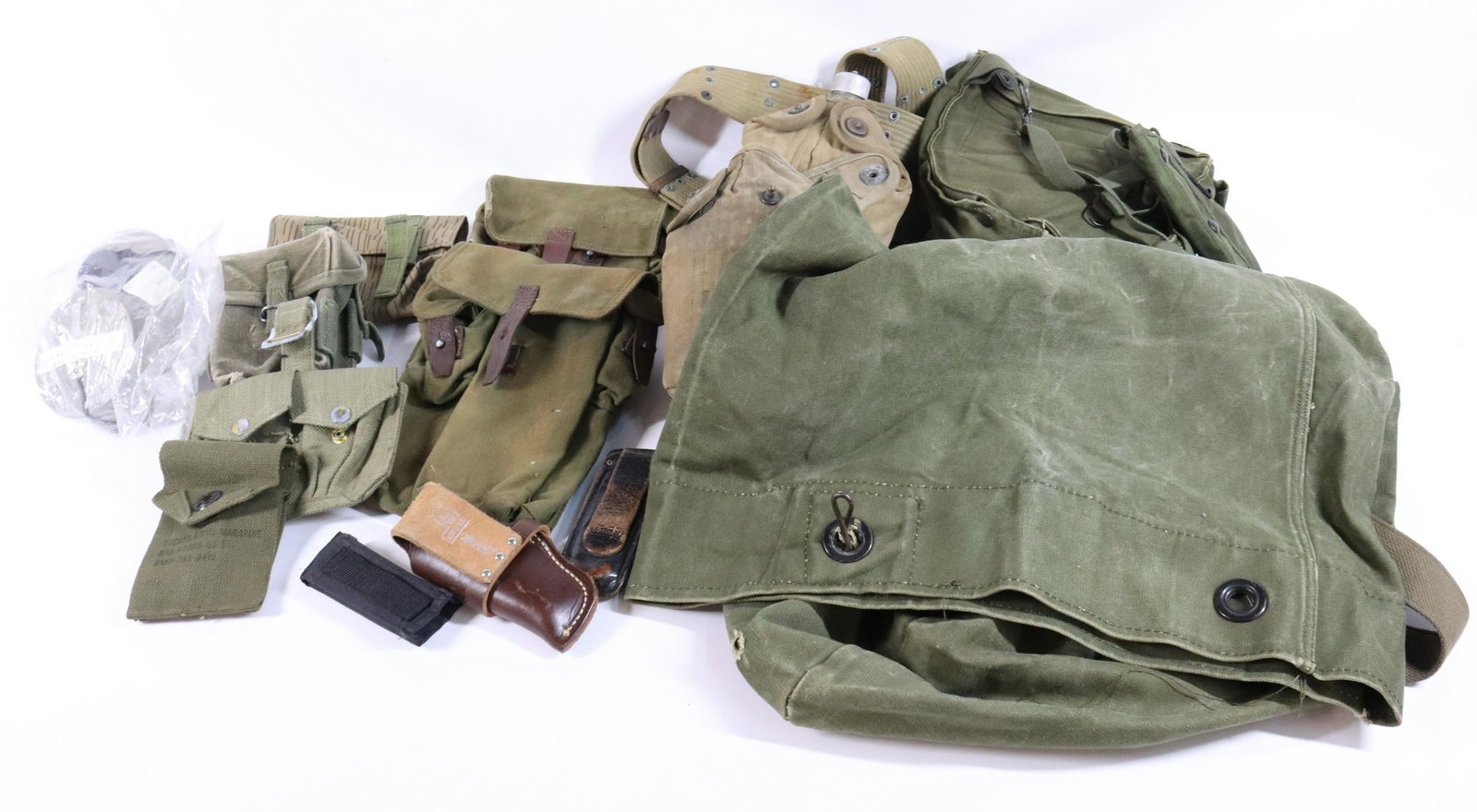 MILITARY LOT: CANTEENTS, CANVAS BAGS, CLIP HOLDERS, GAS MASKS, AND MORE