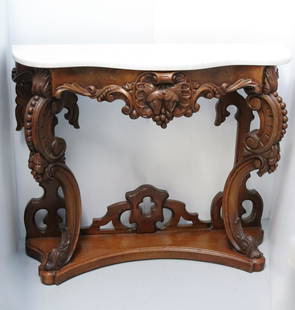 VICTORIAN HALL MARBLE TOP TABLE: MAHOGANY CARVED LEAVES AND GRAPES SERPENTINE FRONT 30'H X 36 1/2" X 13" Terms: Please read Carefully before bidding. This is a Two-Part Estate Sale. Pick-up for these sales will be Tuesday November 8t