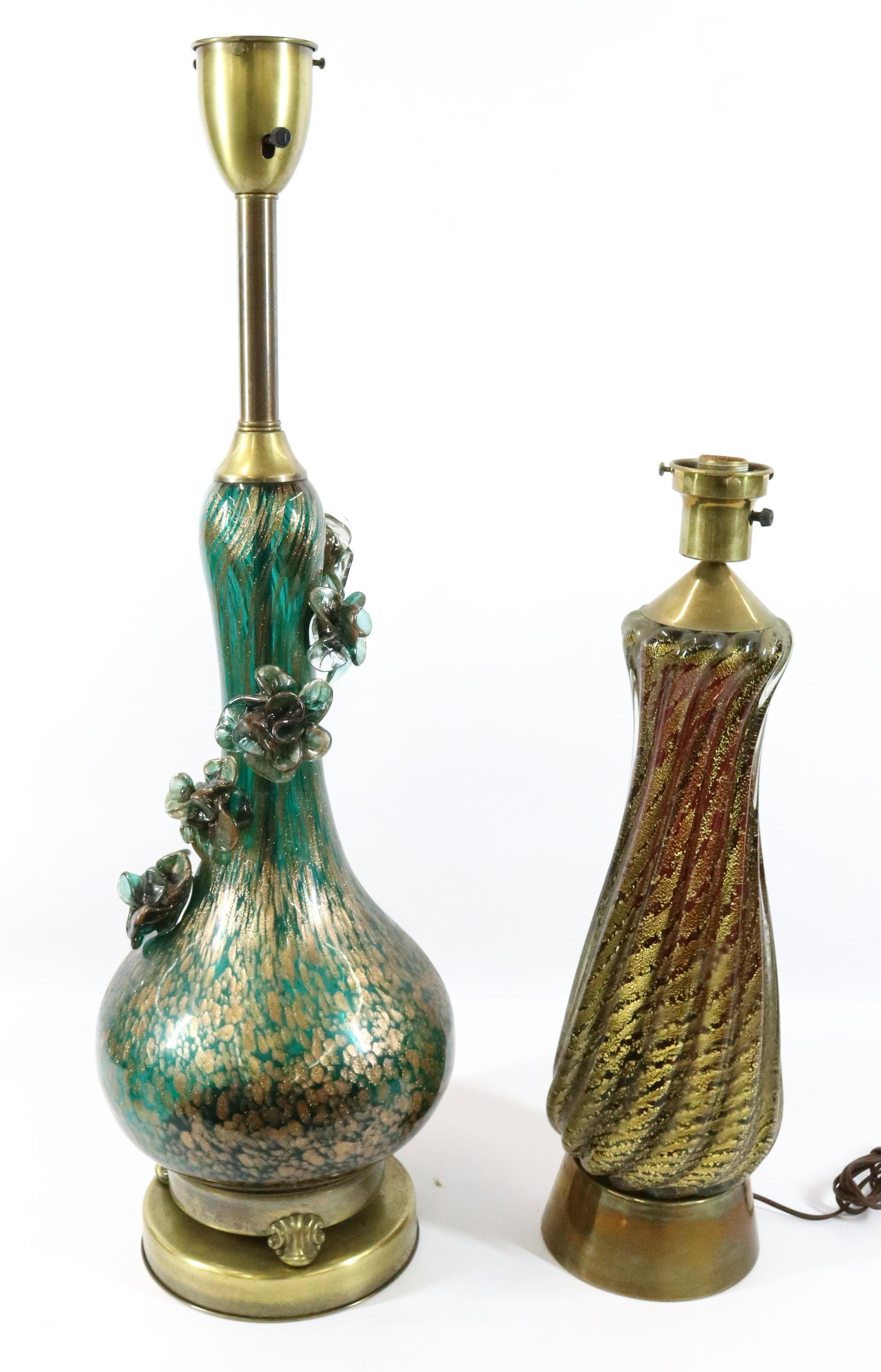 (2) LARGE MURANO LAMPS: EMERALD GREEN WITH GOLD FLECKS AND APPLIED FLOWERS AND HEAVY RIBBED AMETHYST GOLD FLECKS 32 1/2"H X 10 1/2" 22 3/4"H X 6 1/2" Terms: Please read Carefully before bidding. This is a Two-Part Estate Sal