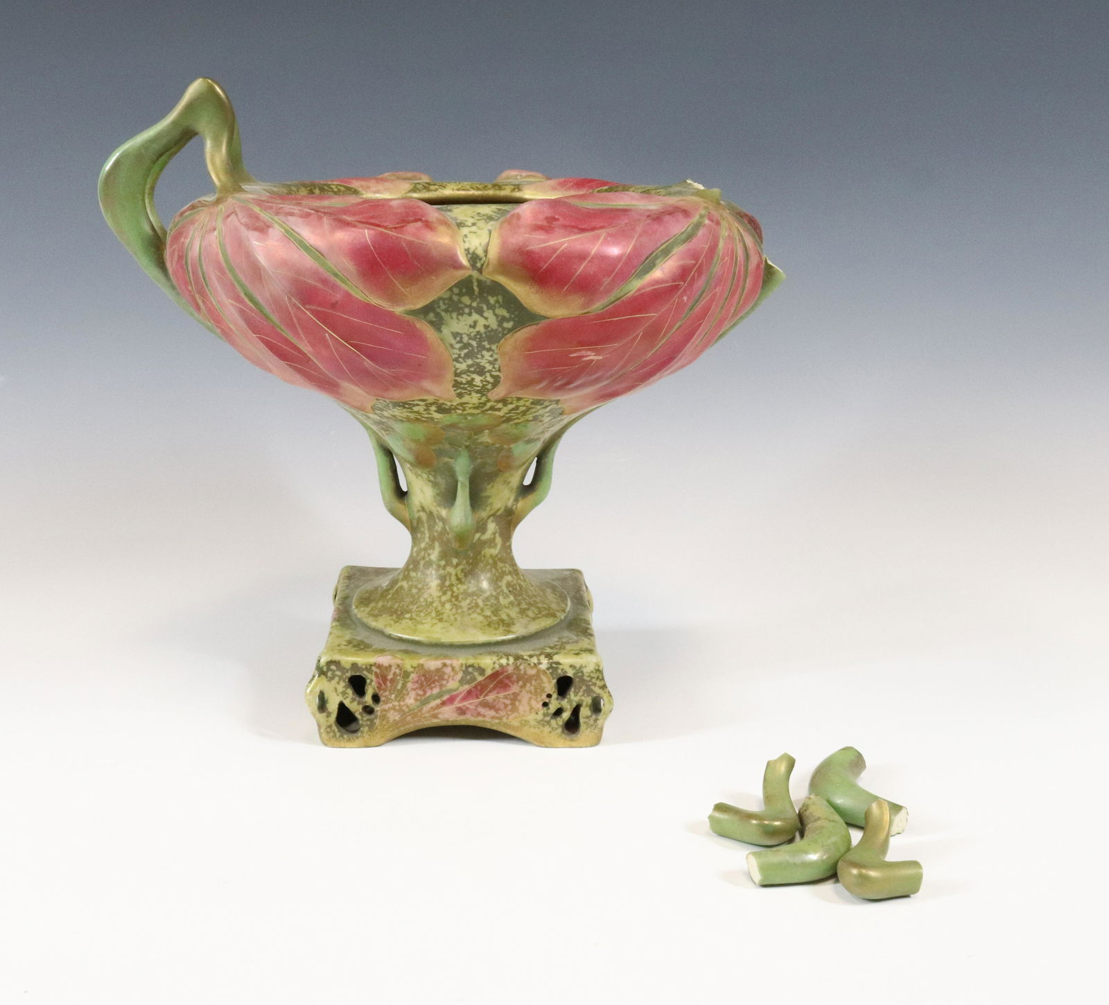 ART NOUVEAU AMPHORA COMPOTE: GREEN AND PINK IMPRESSED MARKS 11"H X 11 1/2" Terms: Please read Carefully before bidding. This is a Two-Part Estate Sale. Pick-up for these sales will be Tuesday November 8th through Friday November