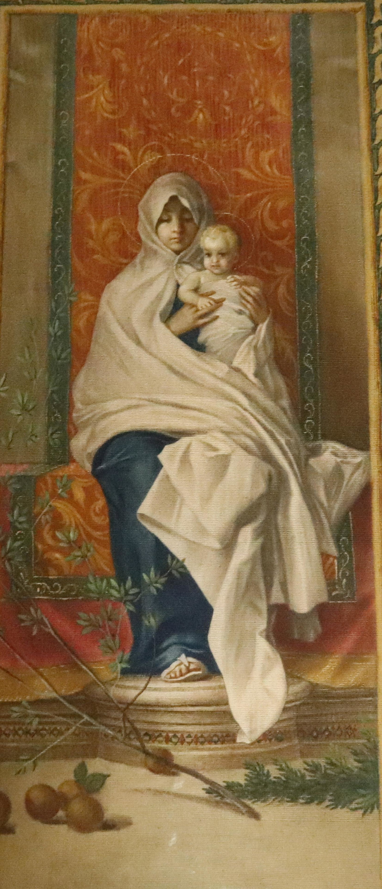FRAMED TEXTILE OF MADONNA OF THE LEMONS: FRAMED UNDER GLASS. MEASURES 37" X 18 1/2" TOTAL SIZE. Terms: Please read Carefully before bidding. This is a Two-Part Estate Sale. Pick-up for these sales will be Tuesday November 8th through Friday 