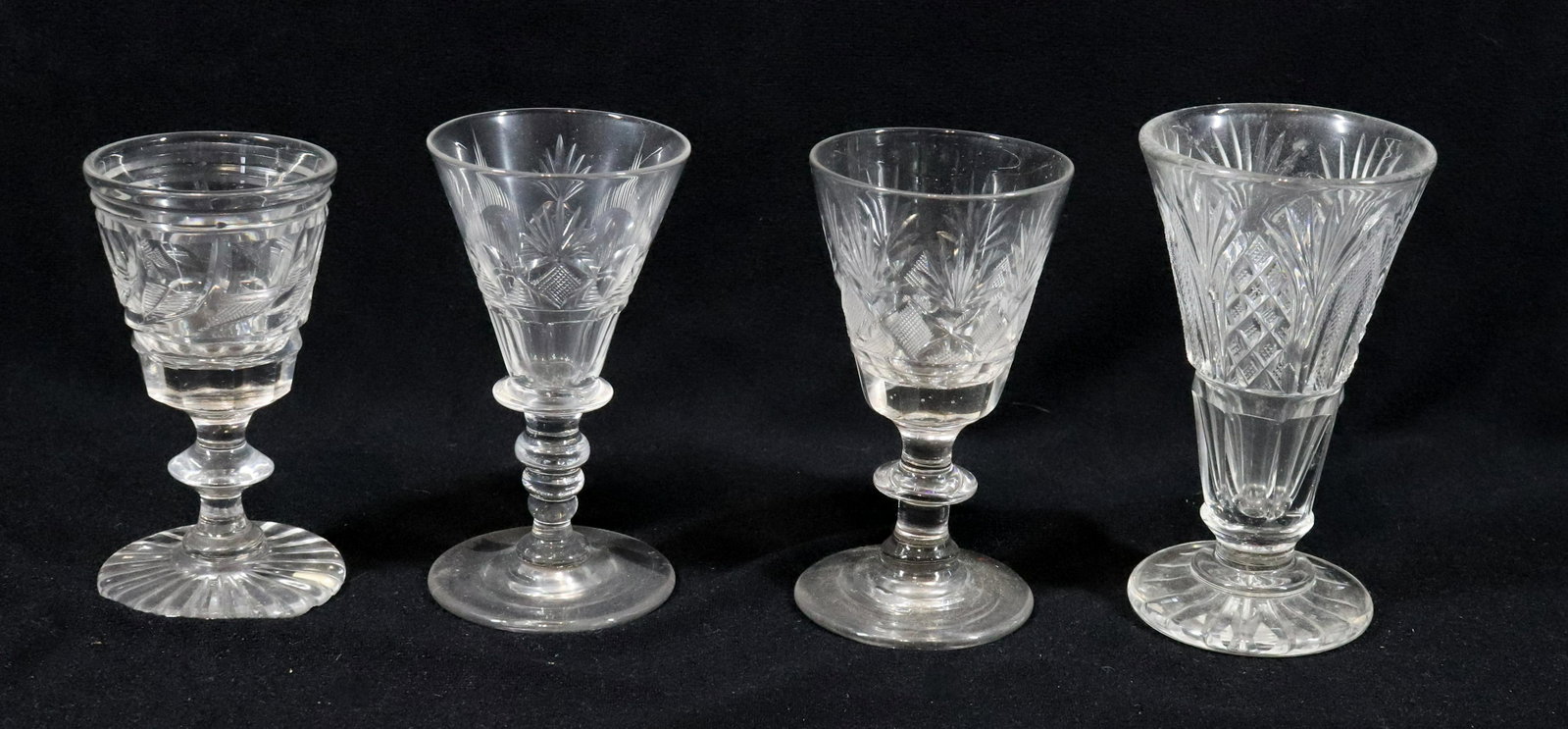 (4) PITTSBURGH CUT GLASS WINE GLASSES: FOUR DIFFERENT PATTERNS ALL WITH PENNY WAFER STEMS POLISHED PONTILS 4" TO 4 1/2" Please Read Carefully before Bidding. Hartzell’s Auction Gallery Inc. will Conduct an ON-SITE and also ON-LINE Au