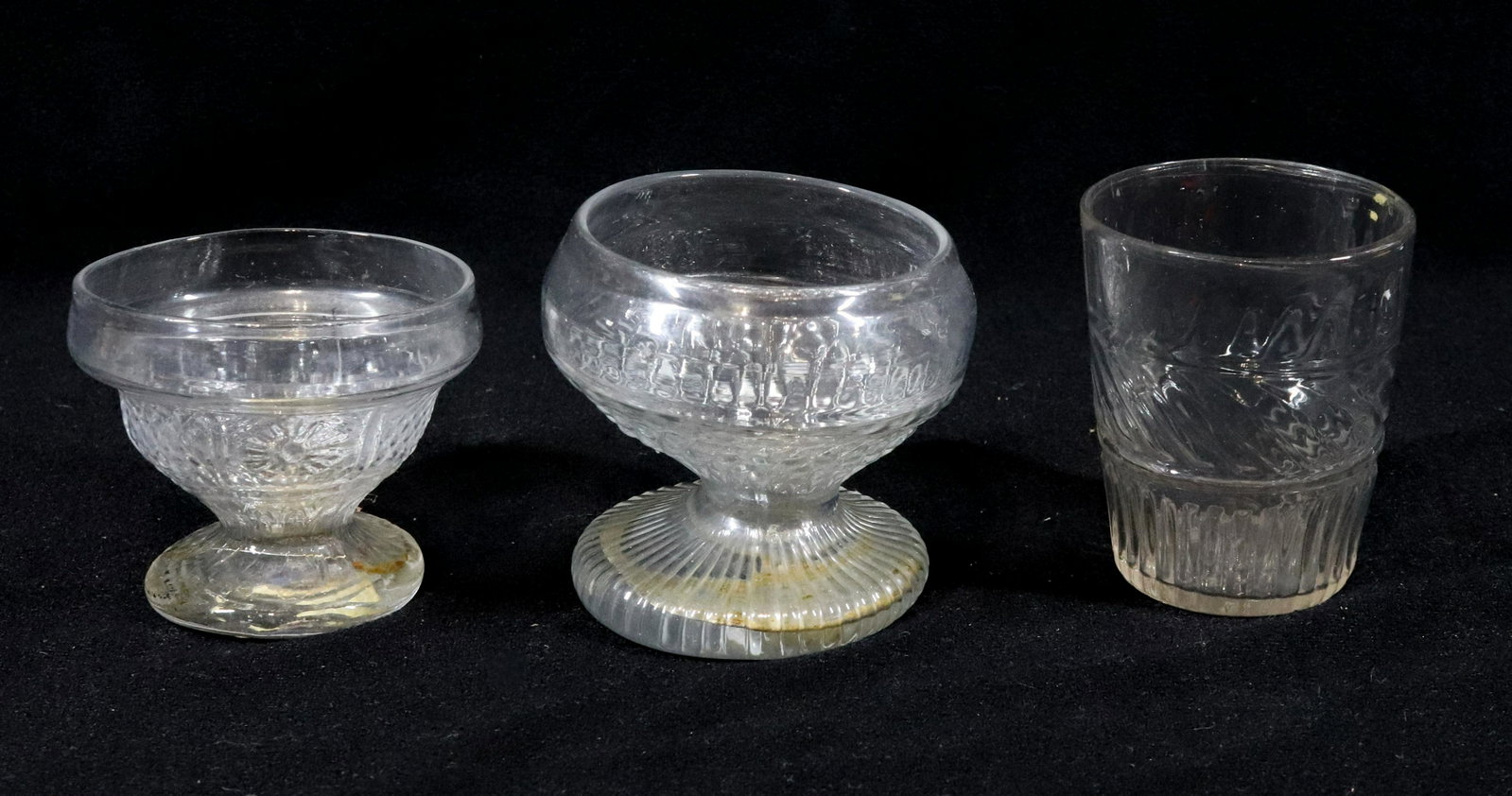 BLOWN IN MOLD GROUPING: (3) GII-19 WINE GLASS, BARREL SHAPED TUMBLER POSSIBLY GII-19 OR SIMILAR, RARE ARCHED PANEL WITH LEAF TUMBLER STAR BASE WITH LIGHT PONTIL. 4" X 2 1/8", 3 1/4" X 3", 3" X 2 7/8" Please Read Carefully be
