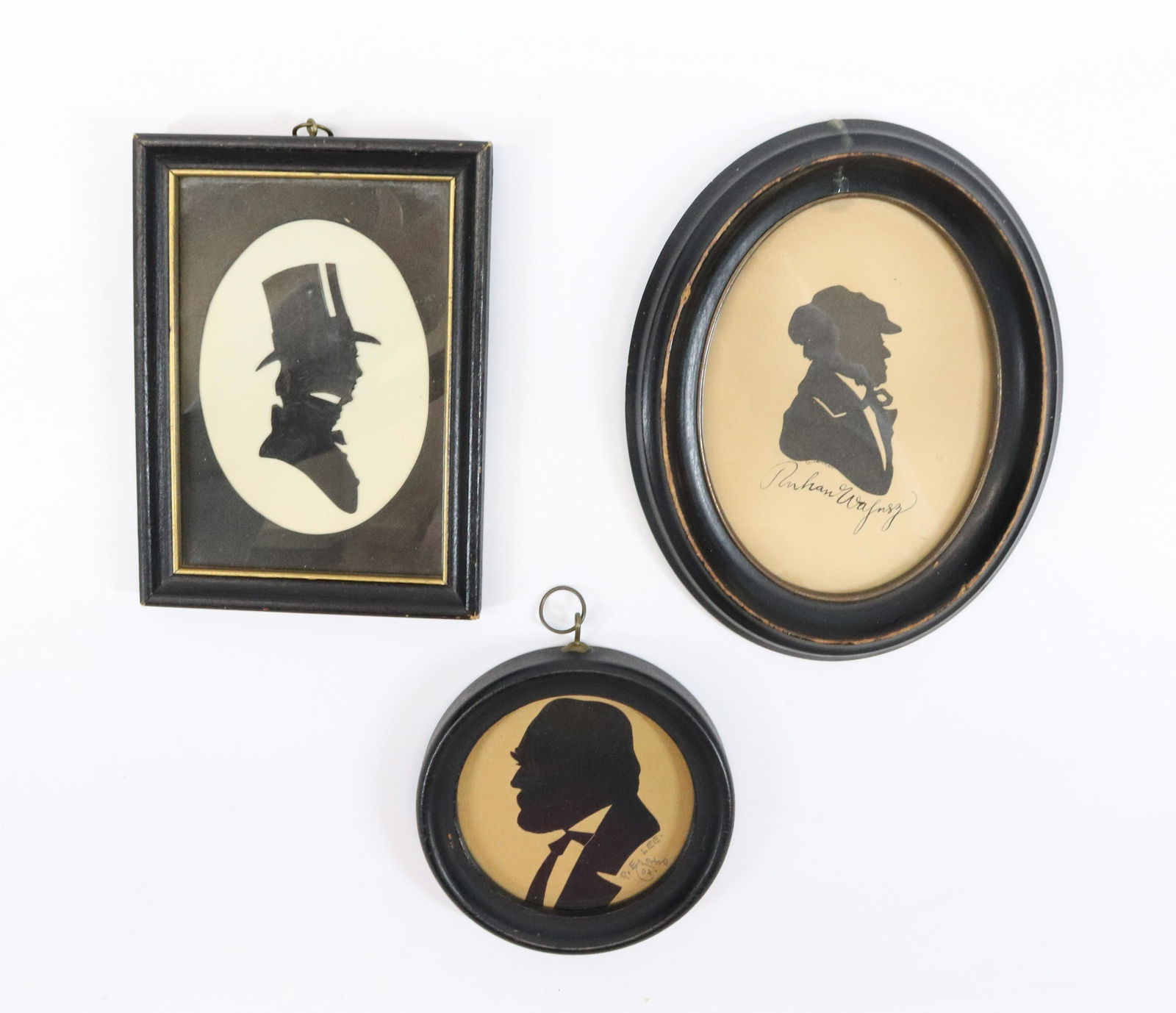 (3) VINTAGE SILHOUETTES: FRAMED UNDER GLASS. OVAL MEASURES 6 3/4" L.