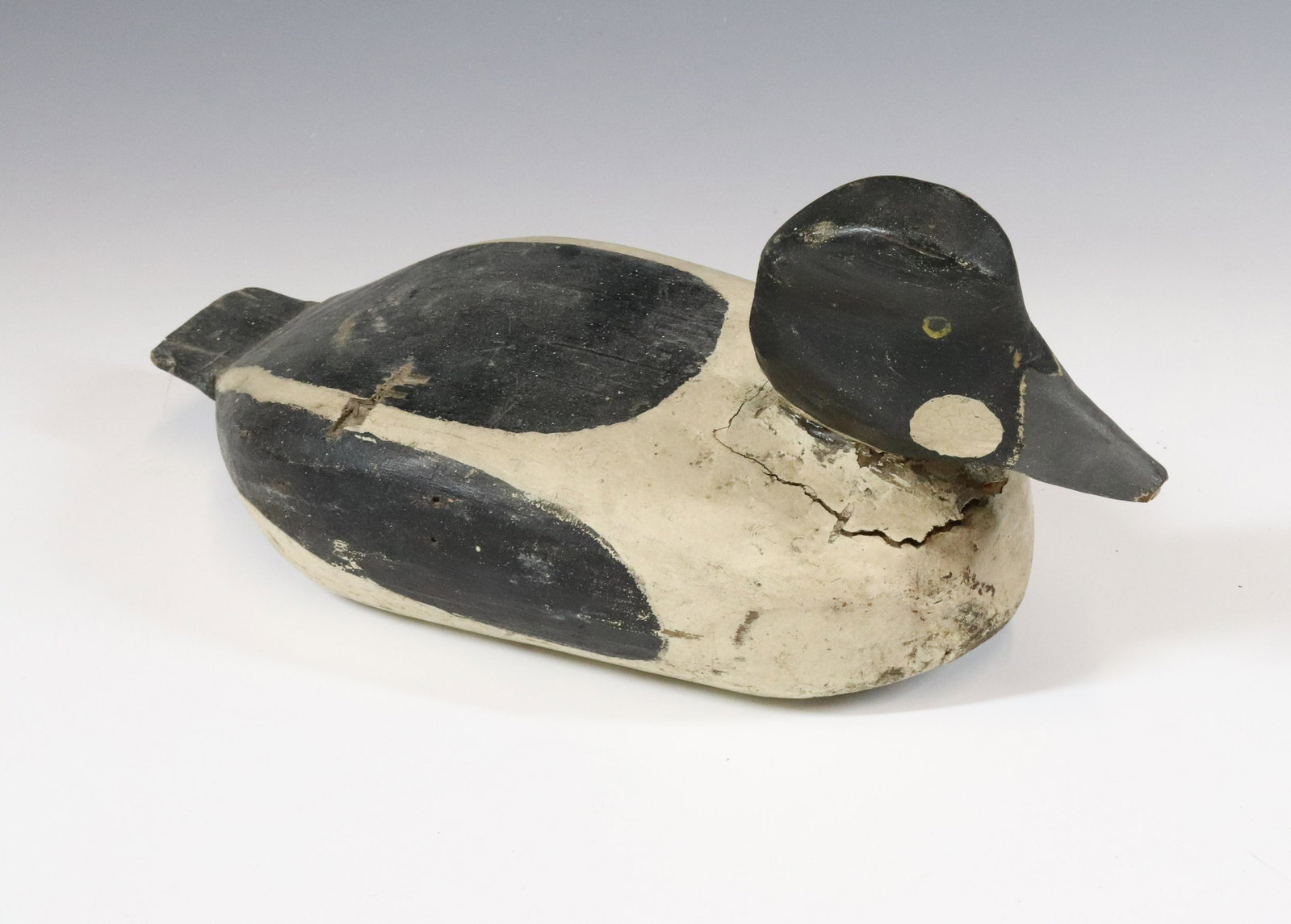 PAINTED WOODEN DECOY: BLACK/WHITE/GRAY PAINTED DECOY WITH WEIGHTED BOTTOM AND TWO LEATHER LOOPS. MEASURES 13 1/4" L. UPDATED 2023 Terms for Purchasing and Shipping of Auction Items. Please read carefully before bidding. Al