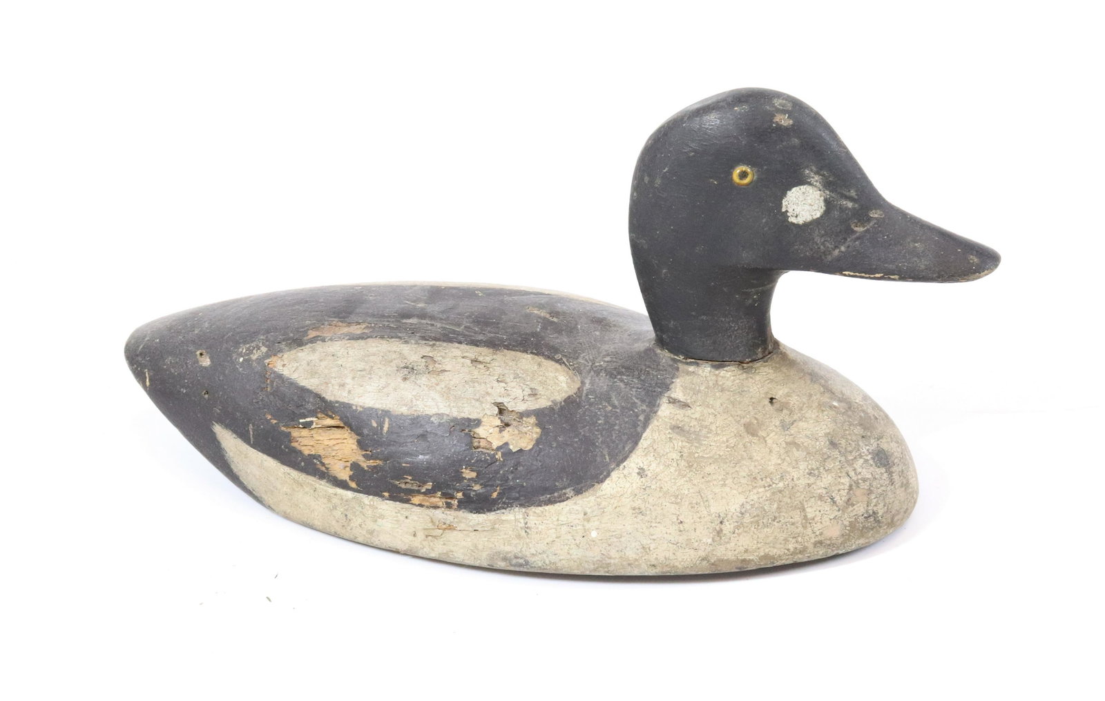 PAINTED WOODEN DECOY: BLACK/WHITE PAINT WITH GLASS EYES. LEAD PLUG AND METAL RING IN BOTTOM. MEASURES 14" L. UPDATED 2023 Terms for Purchasing and Shipping of Auction Items. Please read carefully before bidding. All paymen