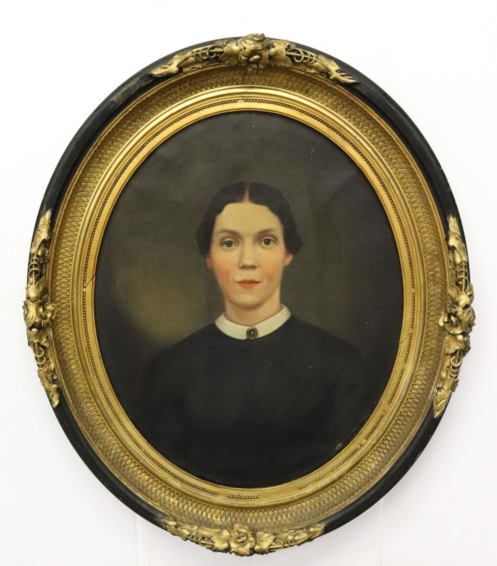 OVAL PORTRAIT OF A WOMAN: OIL ON CANVAS WITH GILT/BLACK ORNATE FRAME. MEASURES 26 1/2" X 21 1/4". UPDATED 2023 Terms for Purchasing and Shipping of Auction Items. Please read carefully before bidding. All payments for purchase