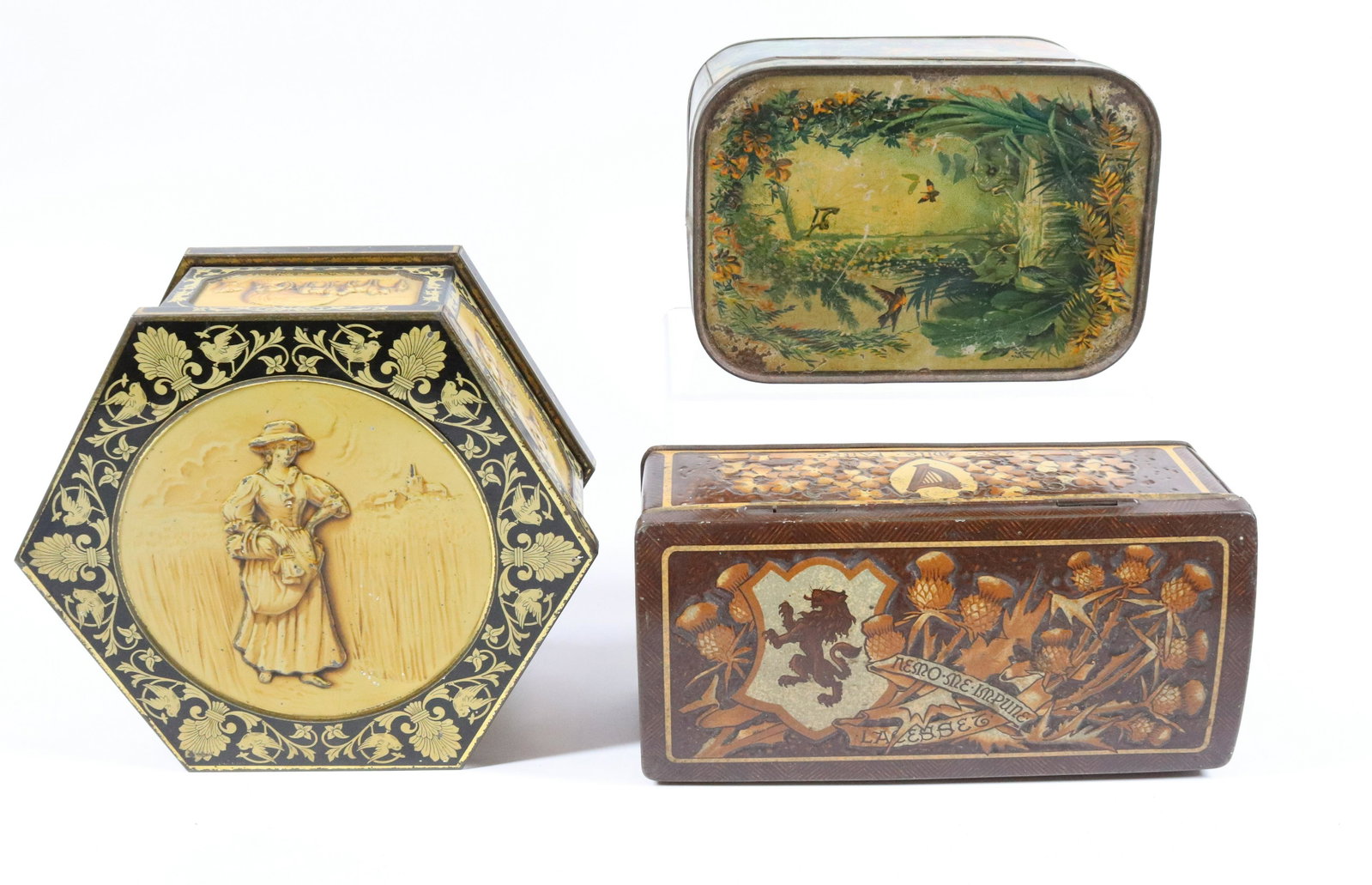 (2) ANTIQUE BISCUIT TINS: PEEK FREAN & CO. TROPICAL BIRD MOTIF, CIRCA 1885 - MACFARLANE LANG & CO. "POKERWORK" - HUNTLEY & PALMERS WITH WOMAN IN FIELD, CIRCA 1908 - 6 1/2", 8", AND 7 1/2" L UPDATED 2023 Terms for Purchasing an