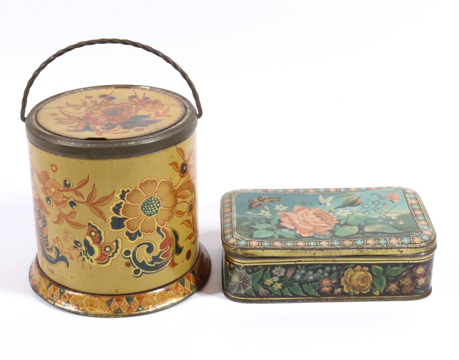 (2) ANTIQUE BISCUIT TINS: MANNAY & CO. FLORAL AND BUTTERFLIES AND DUNN & CO. WITH SWING HANDLE - 6"L AND 5" H UPDATED 2023 Terms for Purchasing and Shipping of Auction Items. Please read carefully before bidding. All payments 