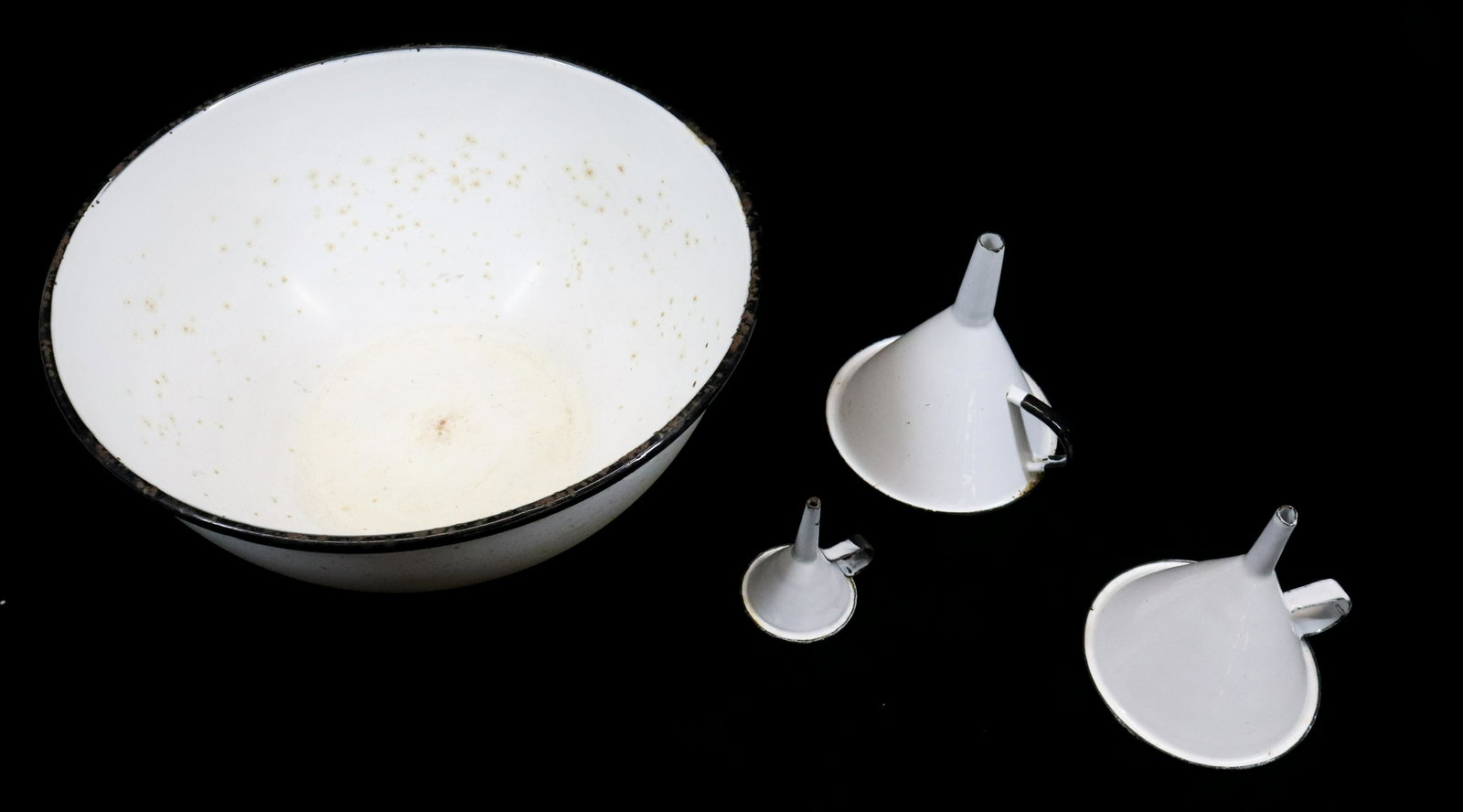 AGATE FUNNELS AND BOWL: WHITE WITH BLACK TRIM. BOWL 11 1/2" D. UPDATED 2023 Terms for Purchasing and Shipping of Auction Items. Please read carefully before bidding. All payments for purchases will be made through LiveAuctio