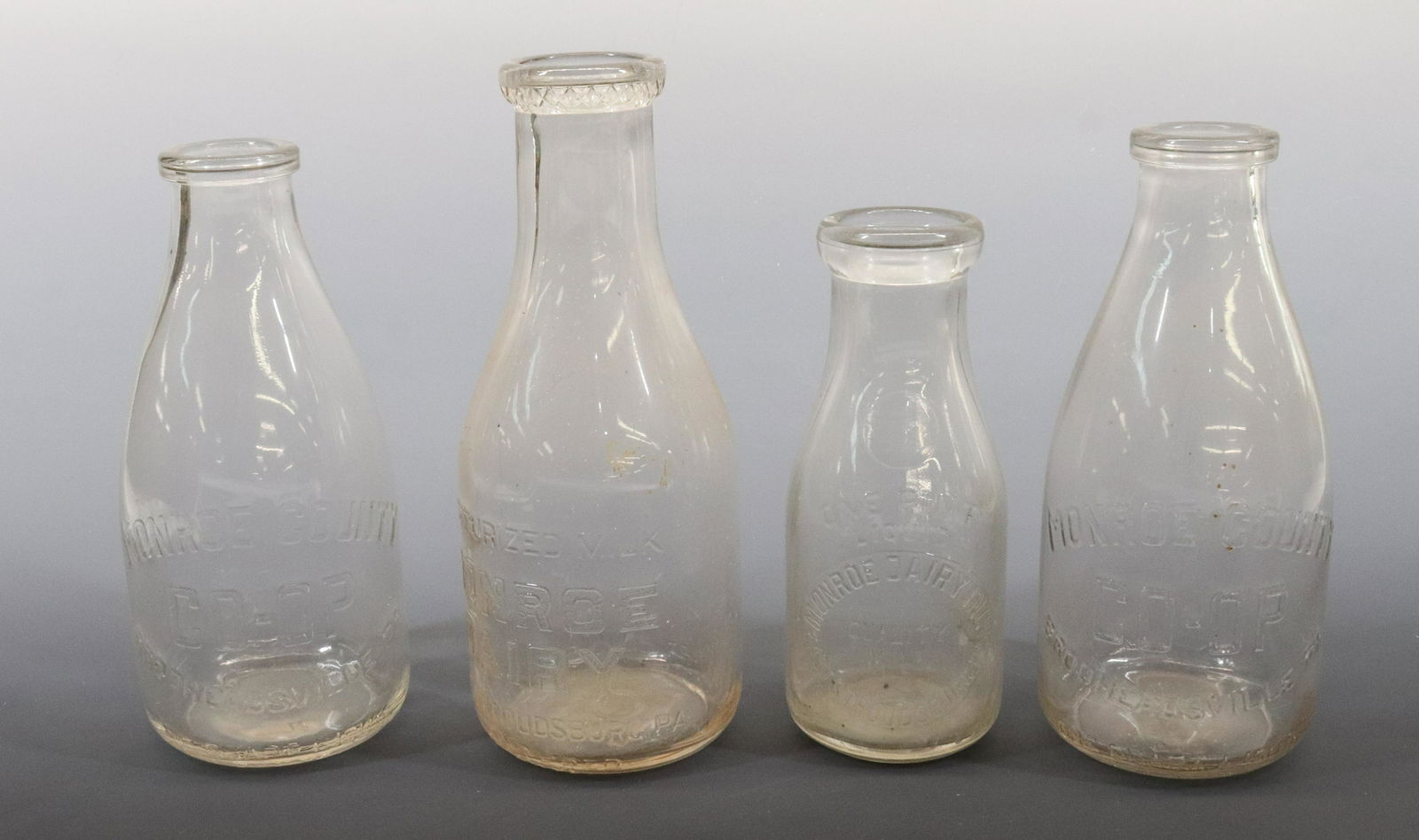 (4) MONROE COUNTY MILK BOTTLES (1 of 5)