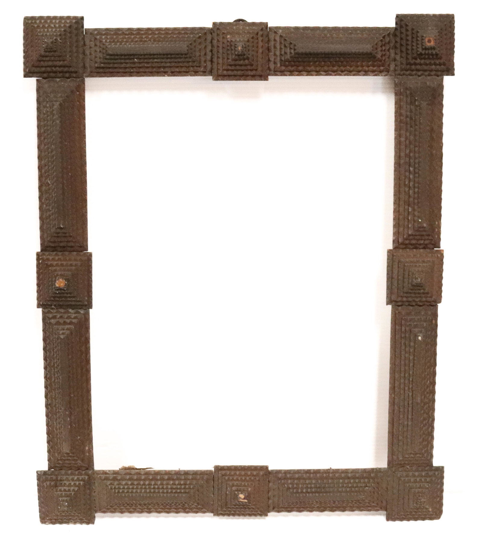 TRAMP ART FRAME: CHIP CARVED, DARK SURFACE - INTERIOR 19 3/4" X 14 3/4" - EXTERIOR 26" X 21" PROVENANCE: UPDATED 2023 TERMS FOR PURCHASING AND SHIPPING OF AUCTION ITEMS. PLEASE READ CAREFULLY BEFORE BIDDING. ALL PAYME