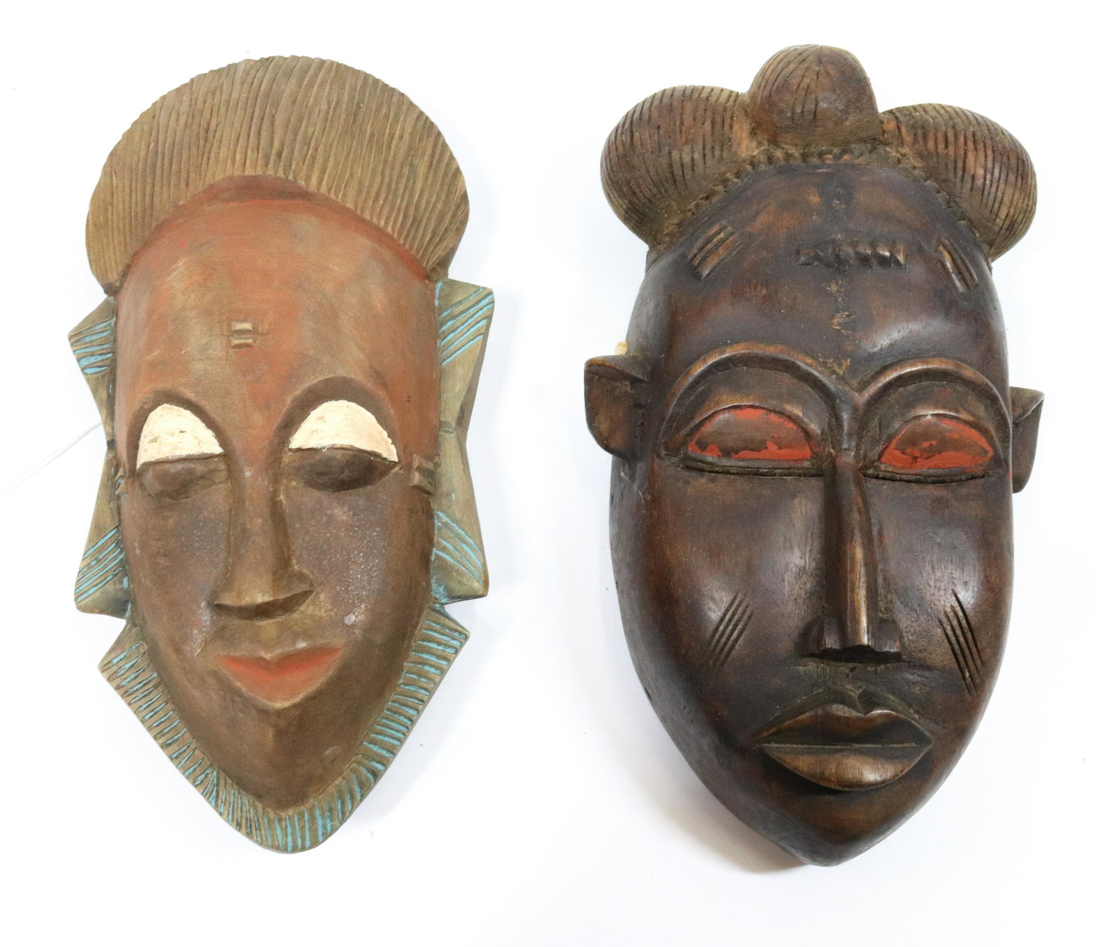 PR. OF TRIBAL MASKS: AFRICAN MASKS CARVED WITH PAINTED HIGHLIGHTS - 10 3/4" PROVENANCE: UPDATED 2023 TERMS FOR PURCHASING AND SHIPPING OF AUCTION ITEMS. PLEASE READ CAREFULLY BEFORE BIDDING. ALL PAYMENTS FOR PURCHASES WIL