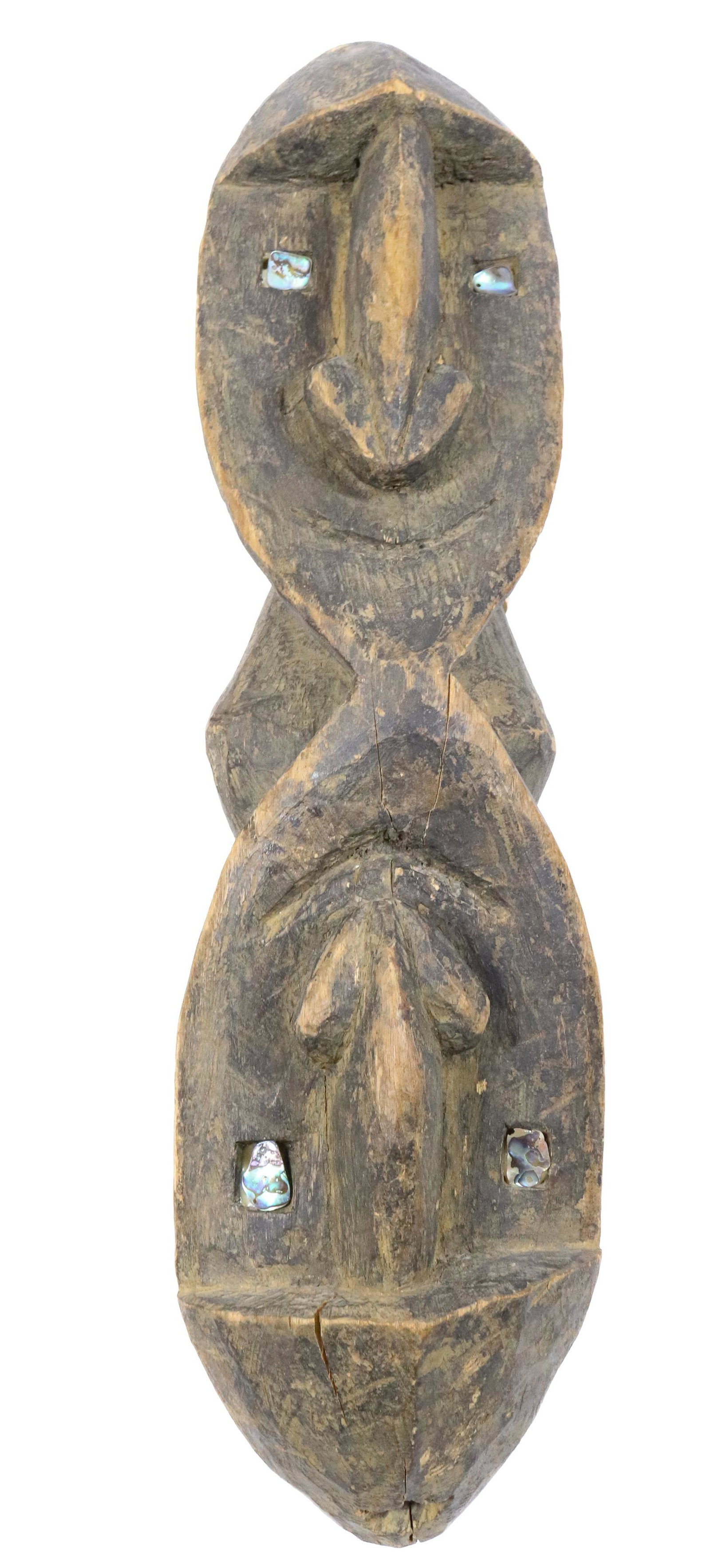 CARVED AFRICAN SCULPTURE: DOUBLE FACED WITH ABALONE SHELL - 19" L PROVENANCE: UPDATED 2023 TERMS FOR PURCHASING AND SHIPPING OF AUCTION ITEMS. PLEASE READ CAREFULLY BEFORE BIDDING. ALL PAYMENTS FOR PURCHASES WILL BE MADE THROU