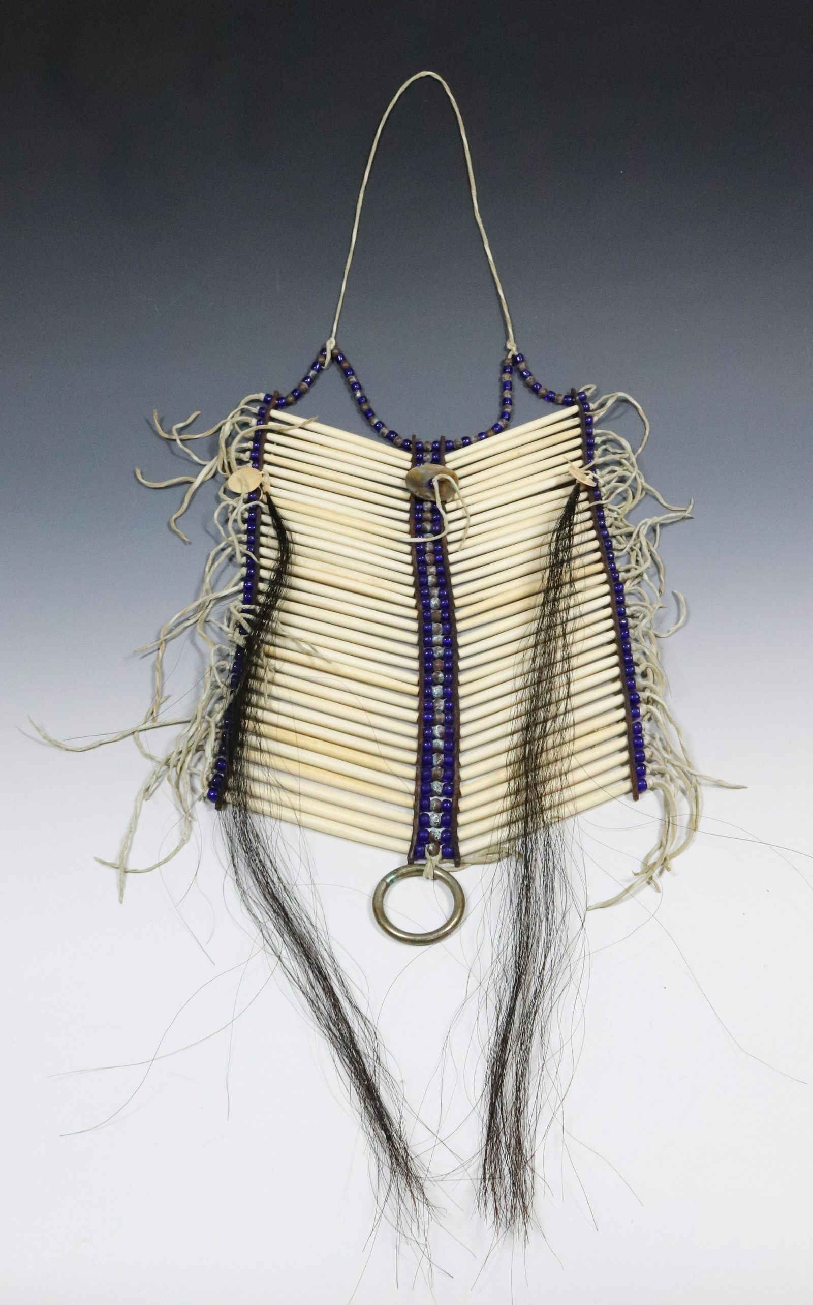 NATIVE AMERICAN BEADED BREASTPLATE: BONE WITH ABALONE DISK. 15" L. UPDATED 2023 TERMS FOR PURCHASING AND SHIPPING OF AUCTION ITEMS. PLEASE READ CAREFULLY BEFORE BIDDING. ALL PAYMENTS FOR PURCHASES WILL BE MADE THROUGH LIVEAUCTIONEERS.CO