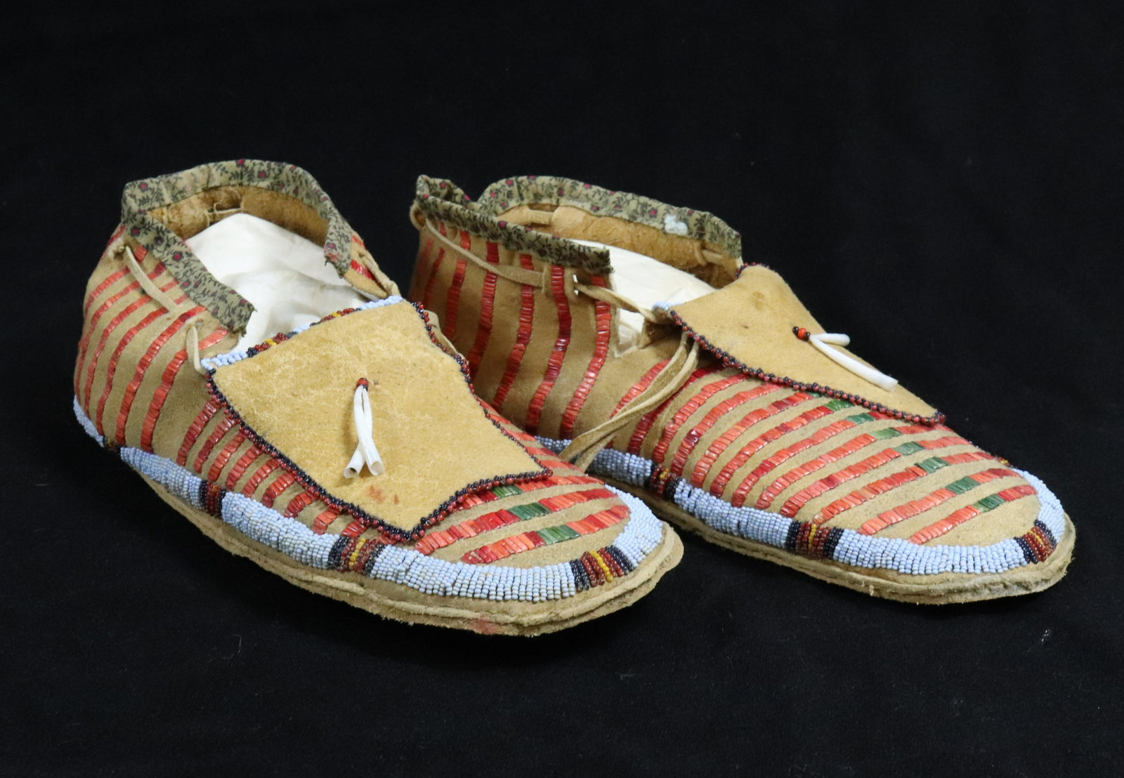 NATIVE AMERICAN QUILLED AND BEADED MOCCASINS: MEASURE 11 1/2" L. UPDATED 2023 TERMS FOR PURCHASING AND SHIPPING OF AUCTION ITEMS. PLEASE READ CAREFULLY BEFORE BIDDING. ALL PAYMENTS FOR PURCHASES WILL BE MADE THROUGH LIVEAUCTIONEERS.COM PAYMENT PR