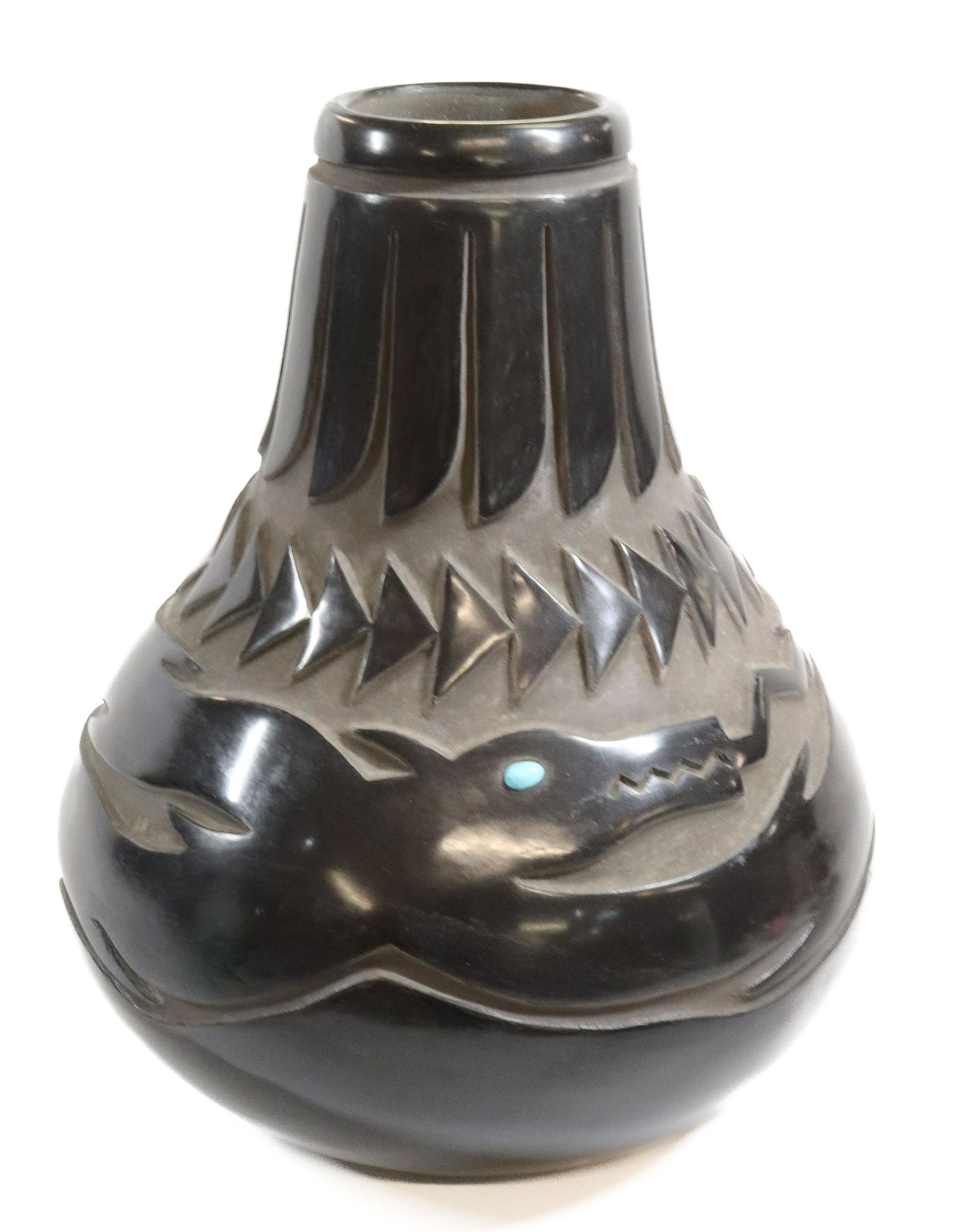 LARGE BLACKWARE POTTERY JAR: CARVED BLACKWARE POT WITH TWO SERPENTS WITH TURQUOISE EYES, SAN ILDEFONSO, UNSIGNED. 16 1/2" H. UPDATED 2023 TERMS FOR PURCHASING AND SHIPPING OF AUCTION ITEMS. PLEASE READ CAREFULLY BEFORE BIDDING. A