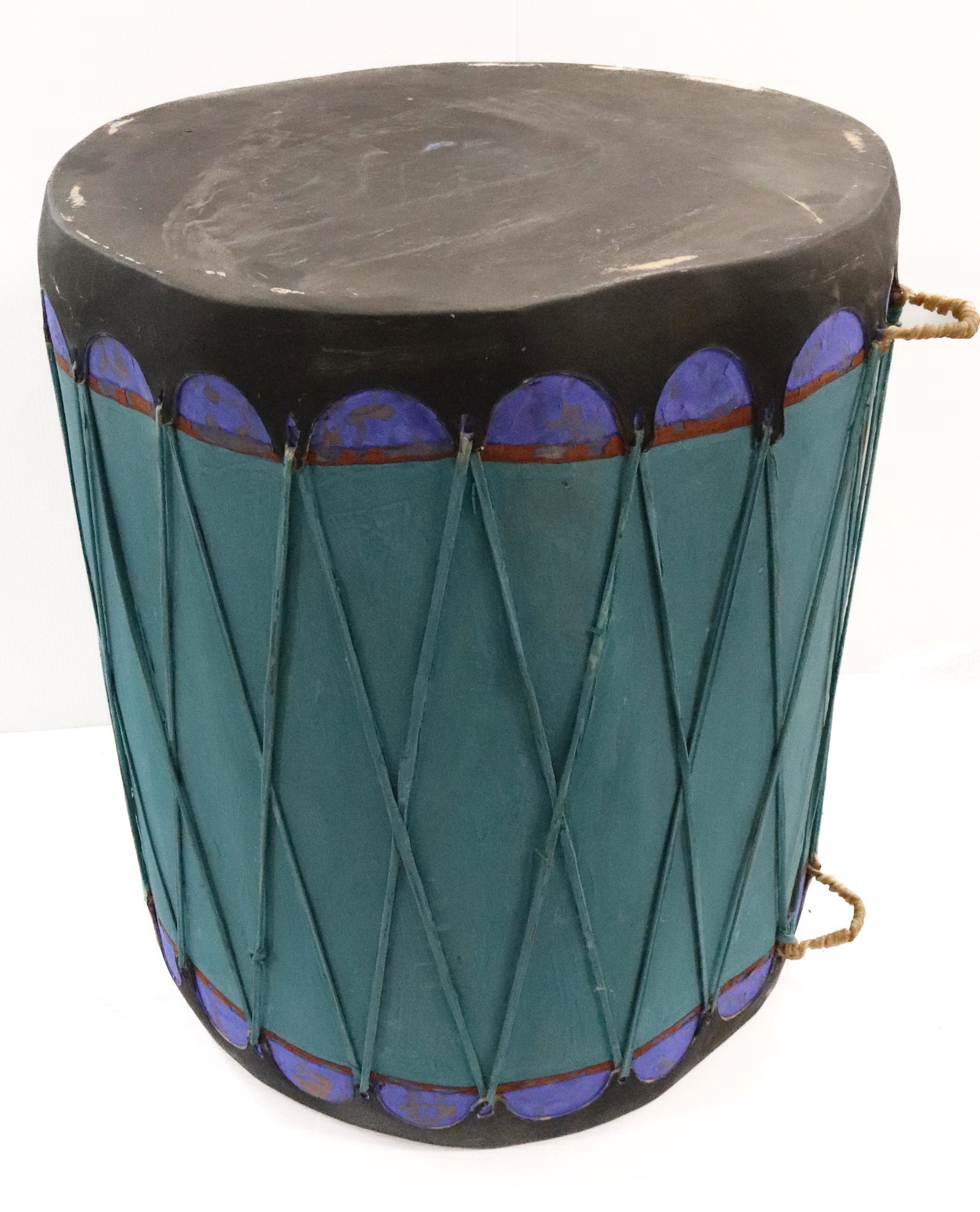 NATIVE AMERICAN CEREMONIAL DRUM: GREEN/BLUE/BLACK. 26" X 22". UPDATED 2023 TERMS FOR PURCHASING AND SHIPPING OF AUCTION ITEMS. PLEASE READ CAREFULLY BEFORE BIDDING. ALL PAYMENTS FOR PURCHASES WILL BE MADE THROUGH LIVEAUCTIONEERS.COM 