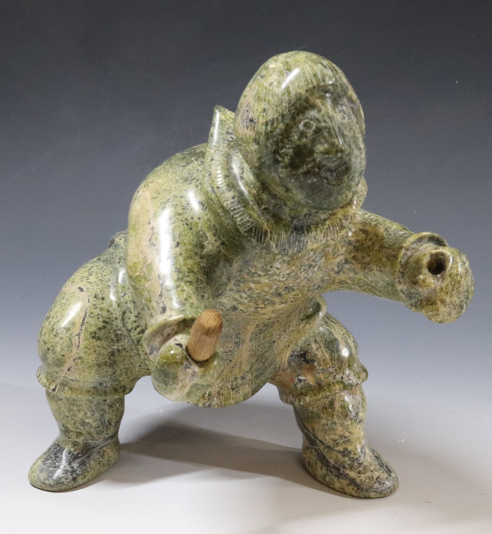 LARGE INUIT STONE CARVING: ESKIMO WITH DRUM - 8 1/4" X 7" UPDATED 2023 TERMS FOR PURCHASING AND SHIPPING OF AUCTION ITEMS. PLEASE READ CAREFULLY BEFORE BIDDING. ALL PAYMENTS FOR PURCHASES WILL BE MADE THROUGH LIVEAUCTIONEERS.CO