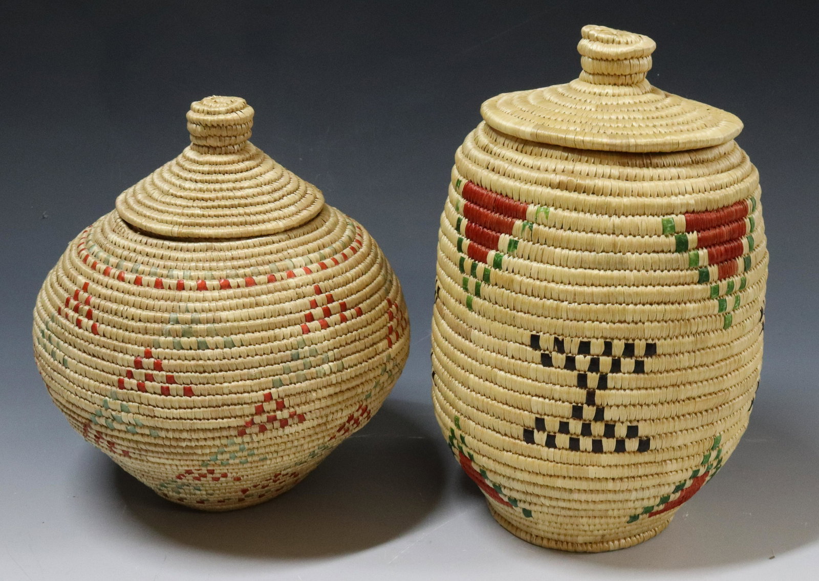 (2) ALASKAN ESKIMO LIDDED BASKETS: COLORED GEOMETRIC DECORATIONS - 7 1/2" H UPDATED 2023 TERMS FOR PURCHASING AND SHIPPING OF AUCTION ITEMS. PLEASE READ CAREFULLY BEFORE BIDDING. ALL PAYMENTS FOR PURCHASES WILL BE MADE THROUGH LIVEAUCT