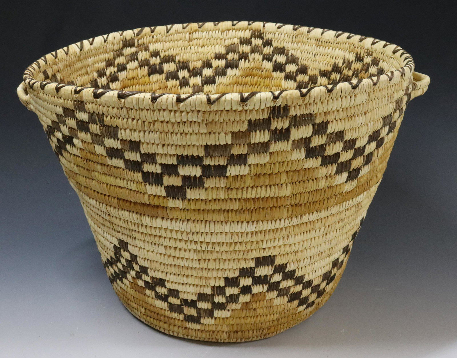 HAND WOVEN STORAGE BASKET: HANDLE ON SIDES - ATTRIBUTED TO; THE PAPAGO PEOPLE, 10" X 14" UPDATED 2023 TERMS FOR PURCHASING AND SHIPPING OF AUCTION ITEMS. PLEASE READ CAREFULLY BEFORE BIDDING. ALL PAYMENTS FOR PURCHASES WILL BE 
