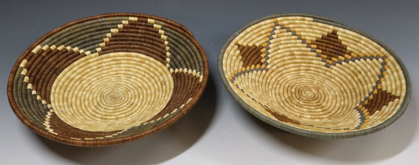 (2) HAND WOVEN SHALLOW BASKETS: DYED WEAVERS IN STAR PATTERN - 2 3/4" X 11 3/4" UPDATED 2023 TERMS FOR PURCHASING AND SHIPPING OF AUCTION ITEMS. PLEASE READ CAREFULLY BEFORE BIDDING. ALL PAYMENTS FOR PURCHASES WILL BE MADE THROUGH L