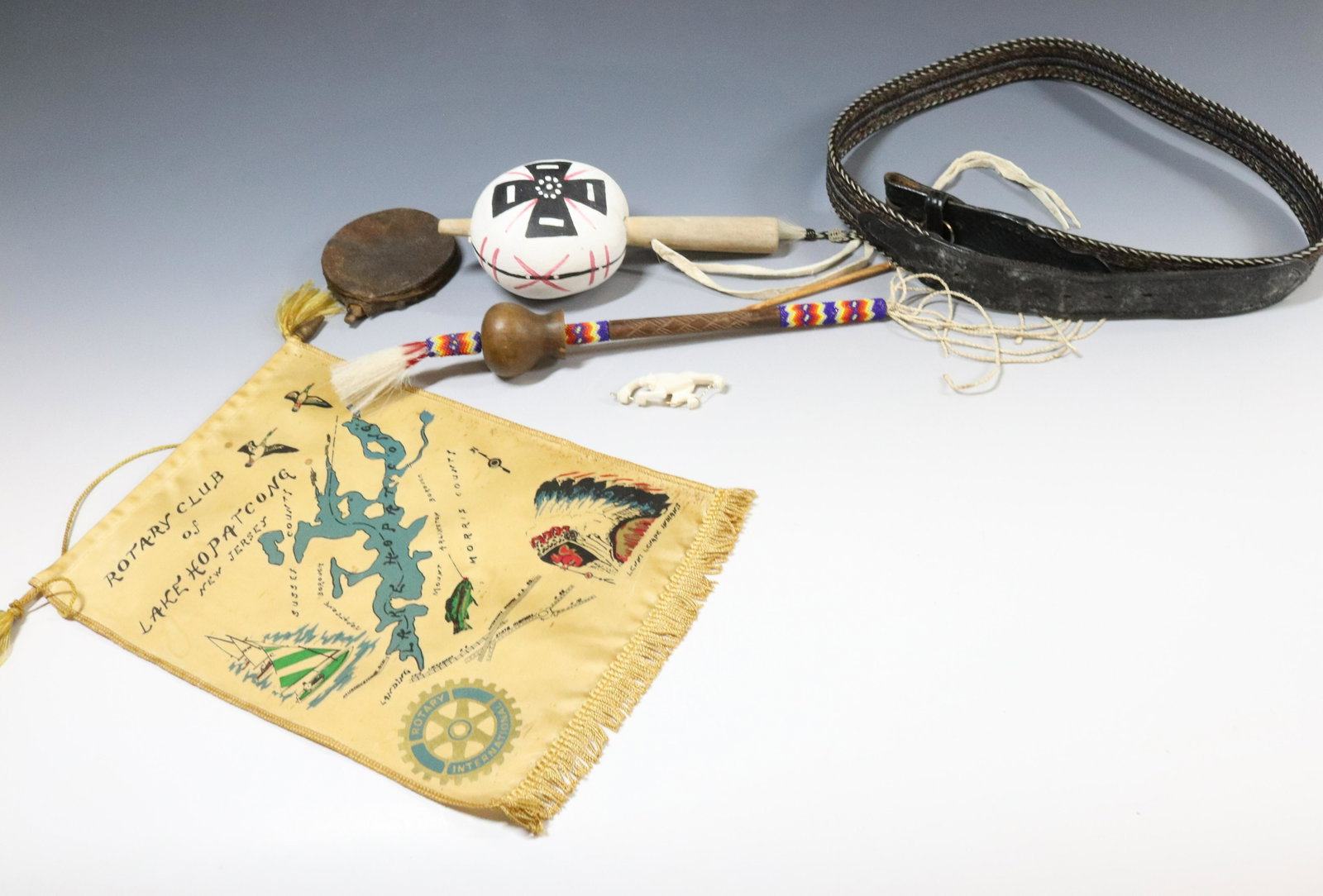 LOT OF NATIVE AMERICAN ITEMS: PAINTED GOURD RATTLE, BEADED RATTLE, LENNI LENAPE BANNER, QUIL DECORATED BELT, AND MORE - RATTLE 8 3/4" SMALL ROUND LEATHER DRUM WAS REMOVED (BELONGED WITH AN INUIT CARVING) UPDATED 2023 TERMS FOR PUR