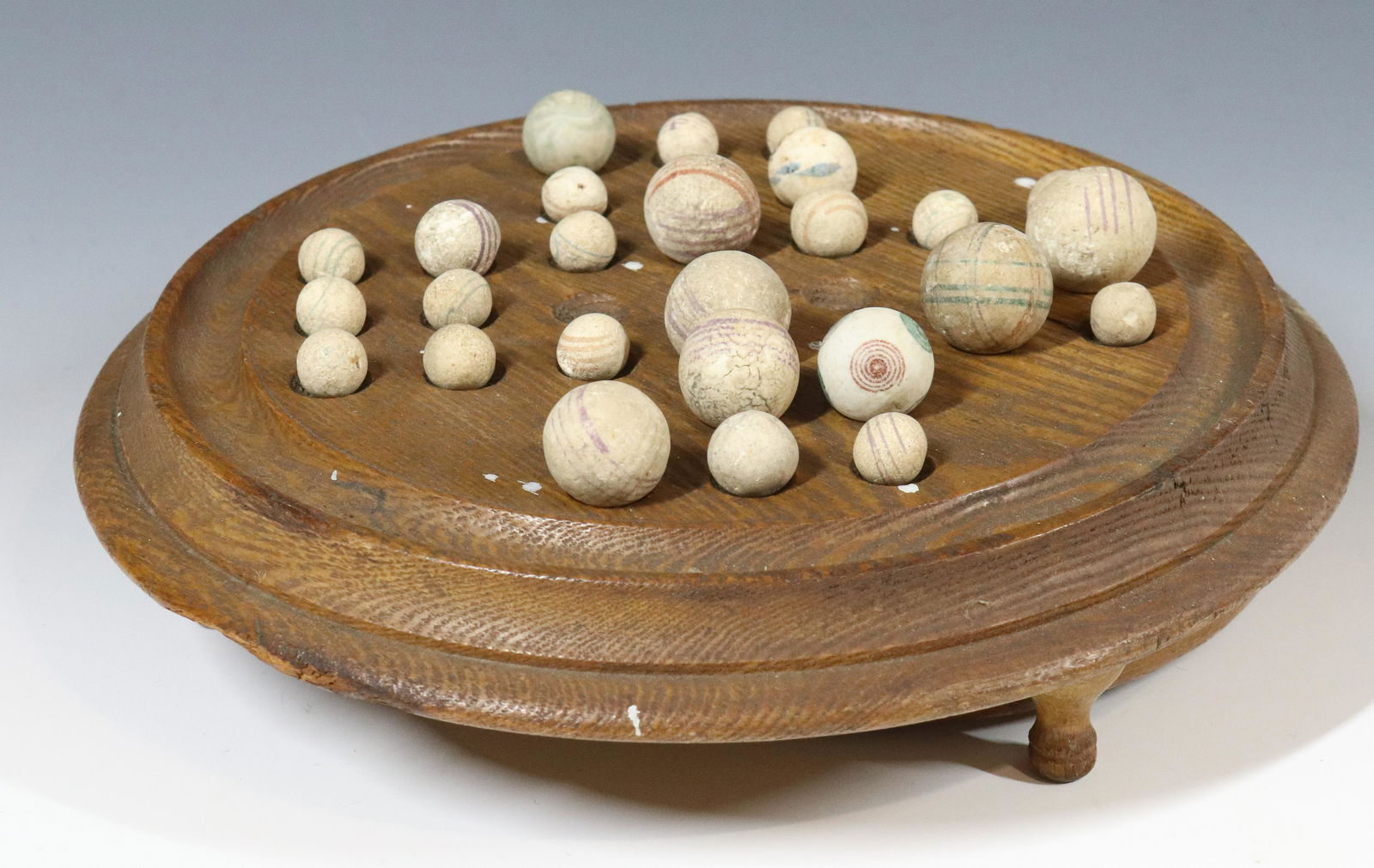 LOT OF STRIPED CLAY MARBLES ON WOODEN GAME BASE: VARIOUS SIZE AND DESIGN, SLIDE OUT DRAWER - 9" D Please Read Carefully before Bidding. Hartzell’s Auction Gallery Inc. will Conduct an ON-SITE and also ON-LINE Auction at 2481 Belvidere Rd, Phil