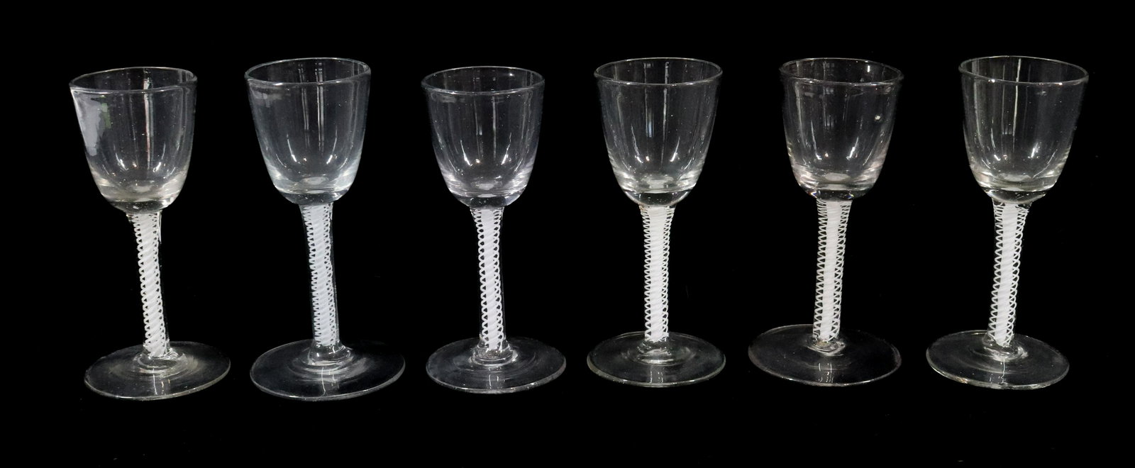 (6) WHITE TWIST STEM WINE GLASSES: 18/19TH CENTURY OPAQUE WHITE TWISTS PONTIL SCAR BASE RIM WEAR 5 1/2" Please Read Carefully before Bidding. Hartzellâ€™s Auction Gallery Inc. will Conduct an ON-SITE and also ON-LINE Auction at 24