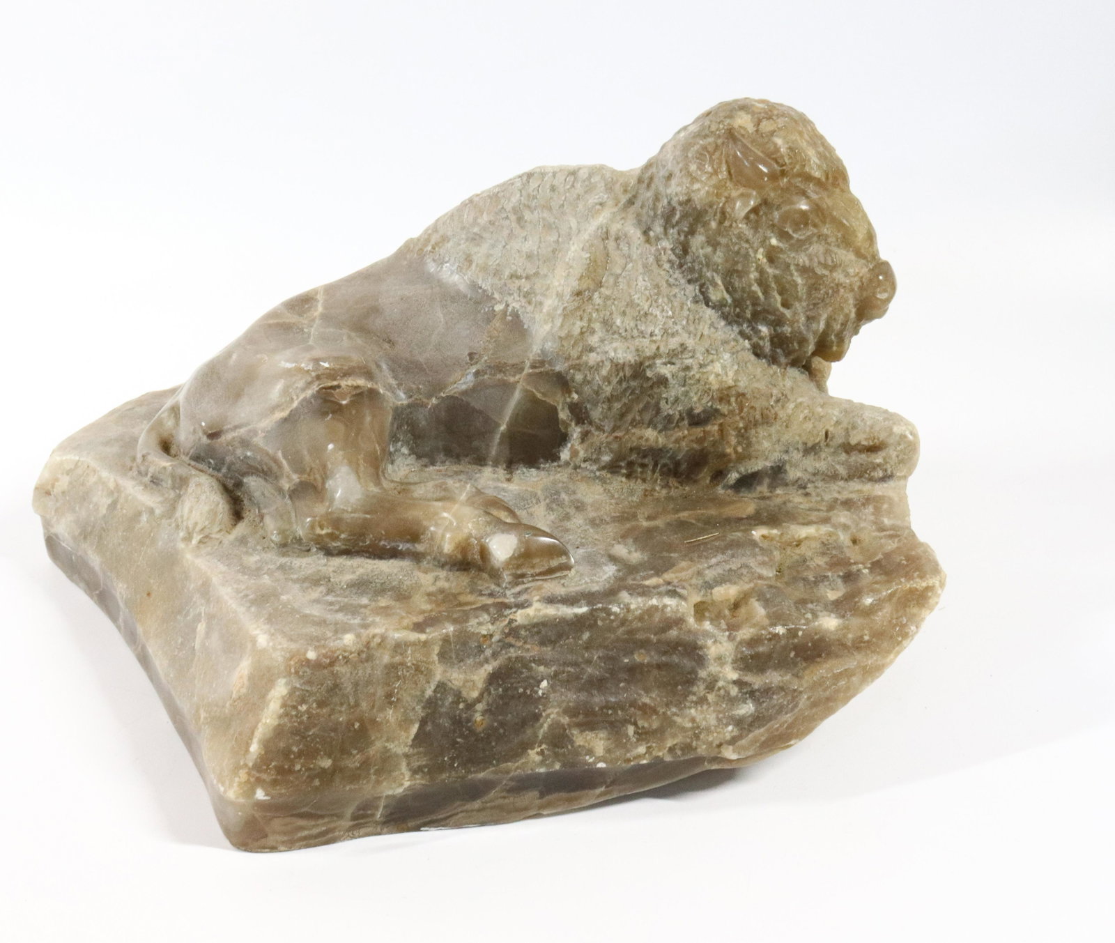 STONE BUFFALO CARVING: LIL MITCHELL HARD STONE CARVING OF A BUFFALO - 15" X 9 1/2" X 7 1/2" Please Read Carefully before Bidding. Hartzell’s Auction Gallery Inc. will Conduct an ON-SITE and also ON-LINE Auction at 248