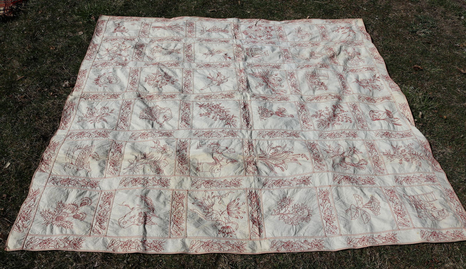 ANTIQUE HAND STITCHED REDWORK TABLE COVERING: VARIOUS ANIMALS, PEOPLE, FLOWERS, SCENES, AND MORE - 75" X 73" Please Read Carefully before Bidding. Hartzell’s Auction Gallery Inc. will Conduct an ON-SITE and also ON-LINE Auction at 2481 Belv