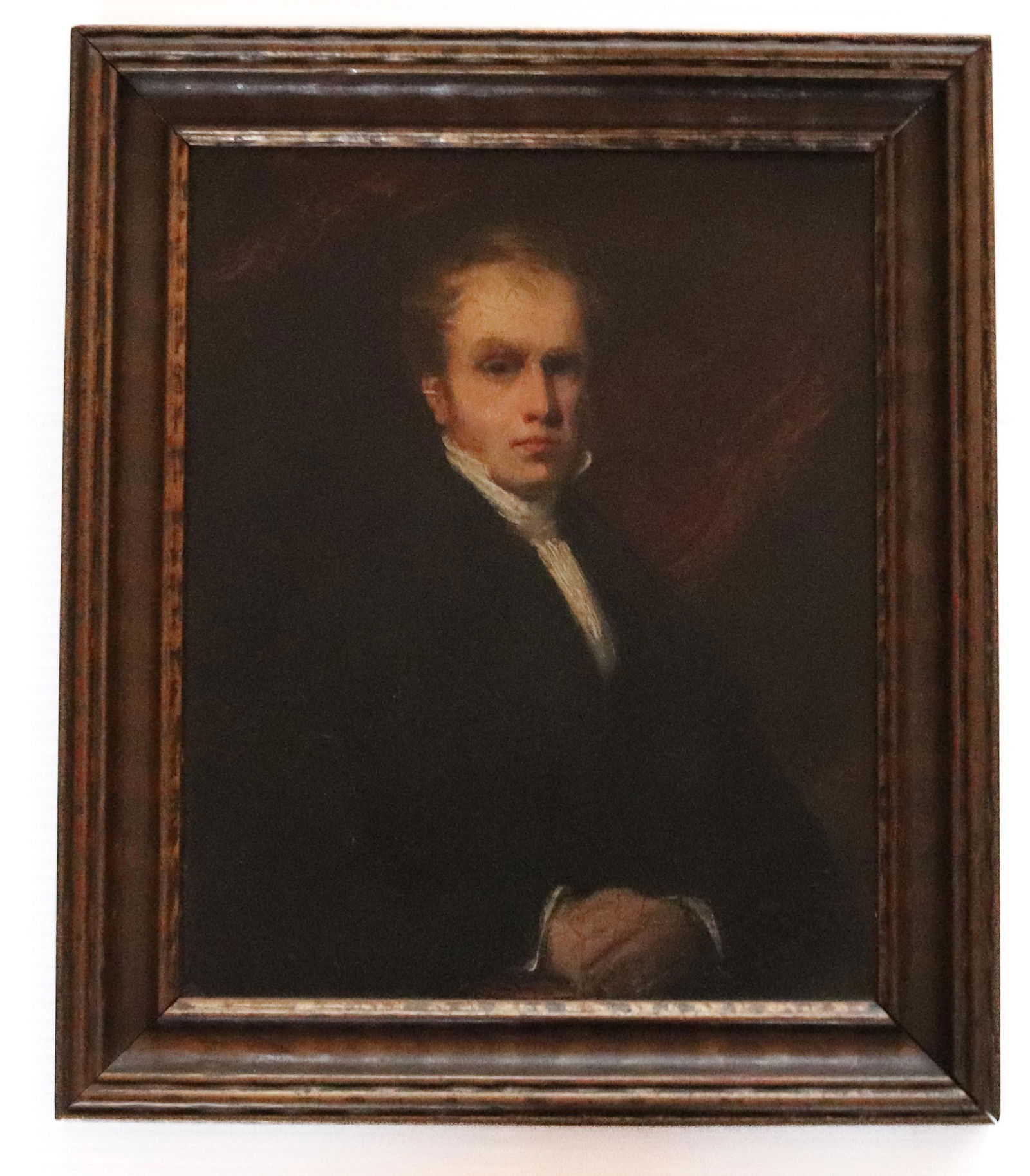 PORTRAIT OF A GENTLEMAN: OIL ON ARTIST BOARD, UNSIGNED - SEATED MAN WITH HANDS CROSSES - "WARING & DIMES, LONDON" MARKED ON BACK - FRAMED 13 1/2" X 11 1/2" Please Read Carefully before Bidding. Hartzell’s Auction Galler
