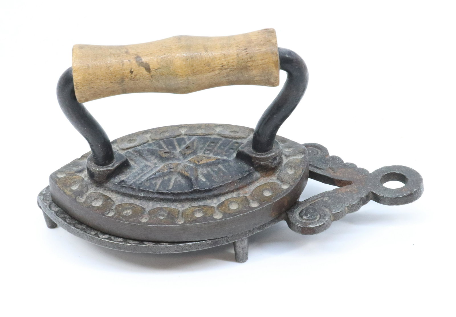MINIATURE CURLED HEAL IRON, AND TRIVET: CURLED HEAL WITH EMBOSSED STAR DESIGN, TRACES OF GOLD AND BLACK PAINT, TRIVET WITH FIGURAL BIRD - ETM 245A AND TRIVET 245B - 3 1/8" Terms: PLEASE READ CAREFULLY BEFORE BIDDING. THIS IS AN ONLINE ONLY 