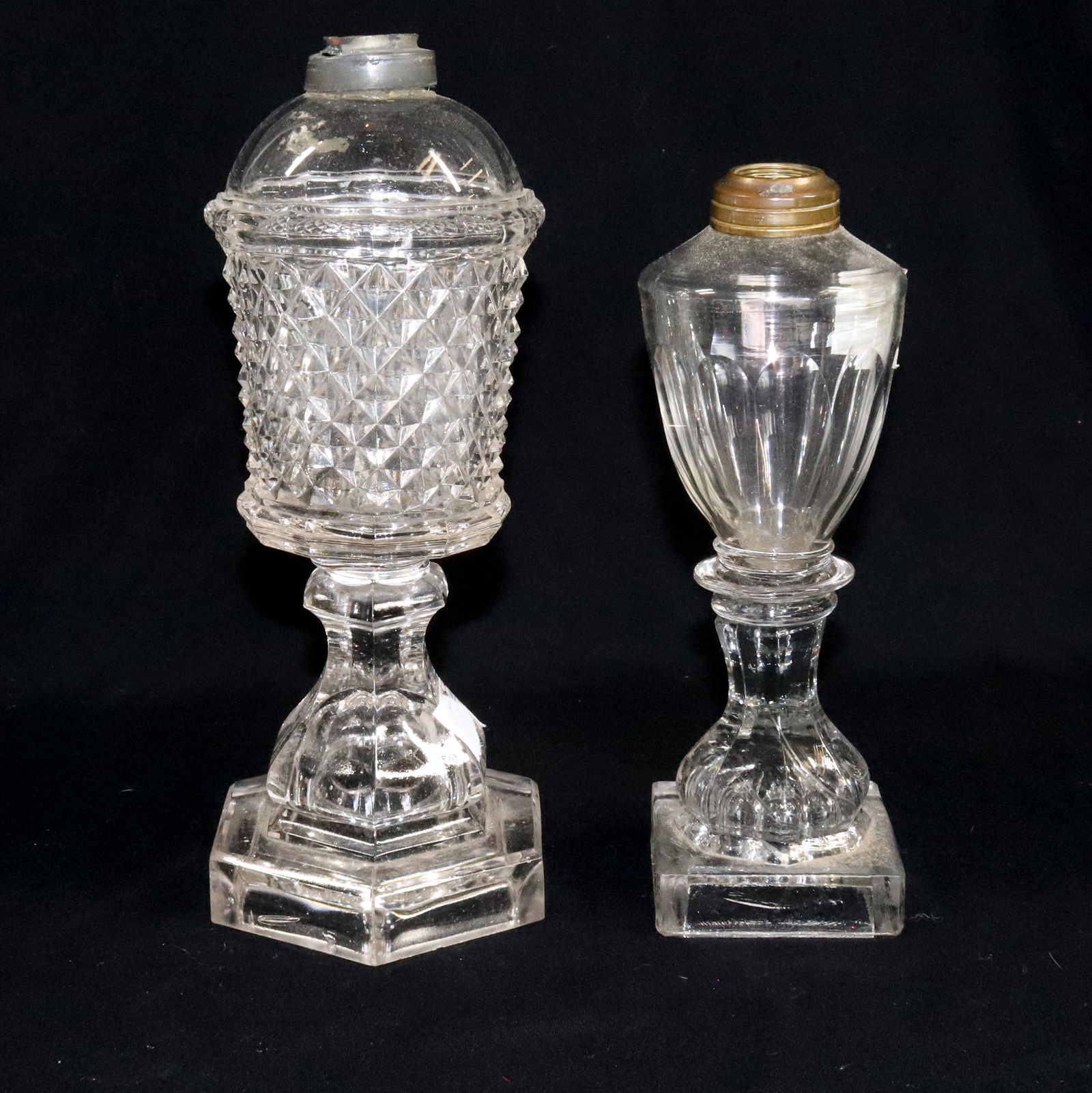(2) FLINT GLASS LAMPS: SAWTOOTH AND CUT PANELS LEMON SQUEEZER BASE 9" 10 1/2" Terms: Please Read Carefully before Bidding. Hartzell’s Auction Gallery Inc. will Conduct an ON-LINE ONLY Auction at 2481 Belvidere Rd, Phillip