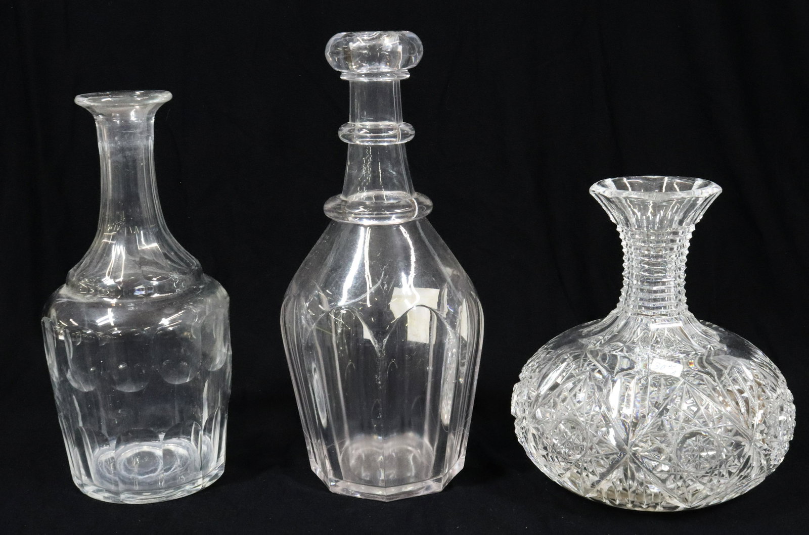 (3) CUT GLASS CARAFE: AMERICAN BRILLIANT CUT GLASS CARAFE, FLINT PRESSED BAR BOTTLE AND PANEL CUT DECANTER 7 1/2" TO 10" TERMS: UPDATED 2023 TERMS FOR PURCHASING AND SHIPPING OF AUCTION ITEMS. PLEASE READ CAREFULLY BEFORE 