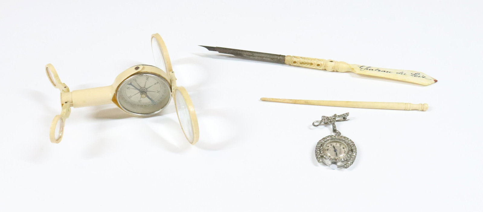 DIP PEN STANHOPE GROUPING: CHATEAU DU LOCK SOUVENIR DIP PEN WITH STANHOPE CELLULOID MAGNIFIER COMPASS AND RHINESTONE BROOCH WATCH WORKING AND BONE KNIT NEEDLE 8" PEN TERMS: UPDATED 2023 TERMS FOR PURCHASING AND SHIPPING OF AUCT
