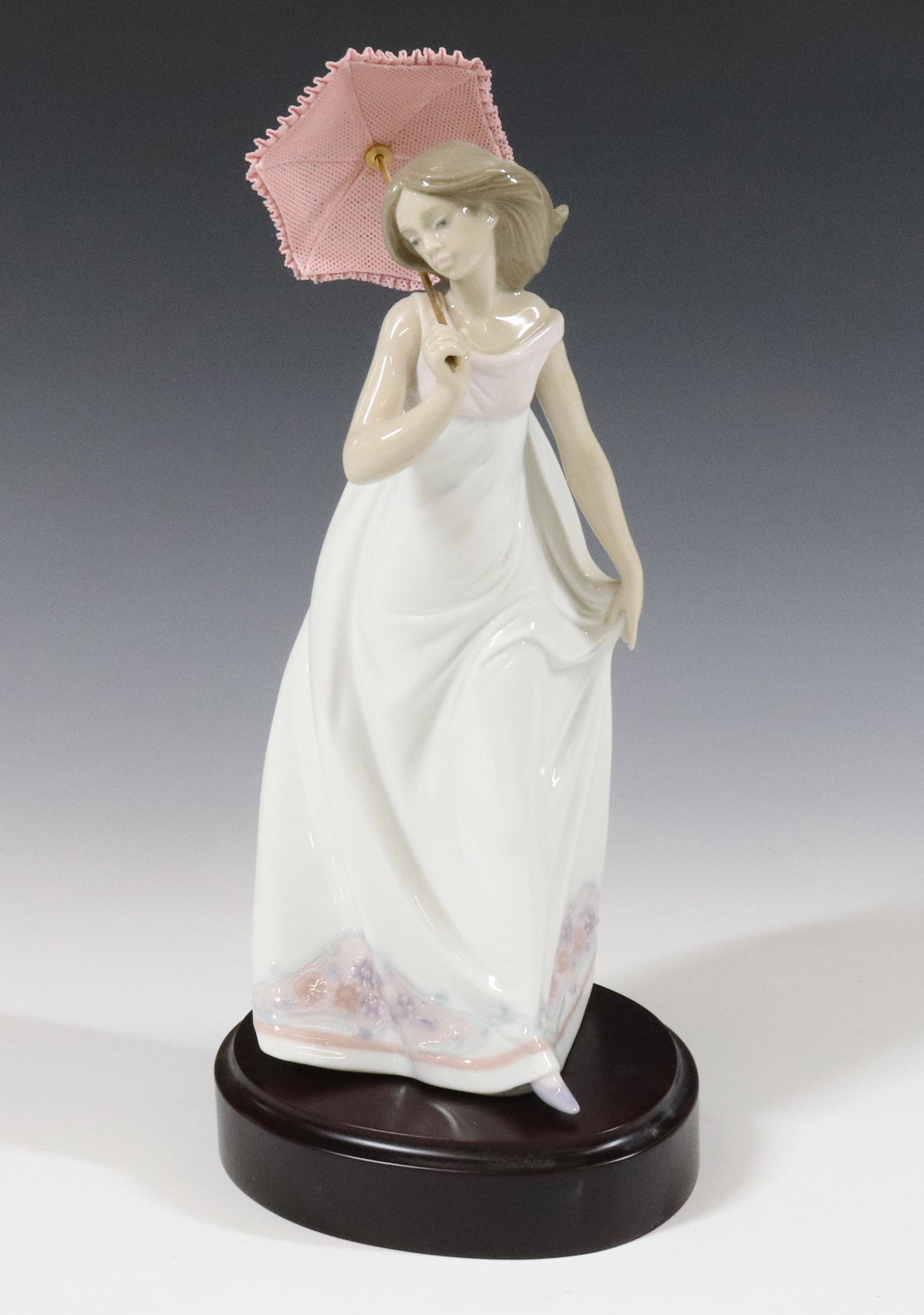 1995 LLADRO LADY WITH UMBRELLA: #7636 DIANA 11" WITH BOX TERMS: UPDATED 2023 TERMS FOR PURCHASING AND SHIPPING OF AUCTION ITEMS. PLEASE READ CAREFULLY BEFORE BIDDING. ALL PAYMENTS FOR PURCHASES WILL BE MADE THROUGH LIVEAUCTIONEERS.C