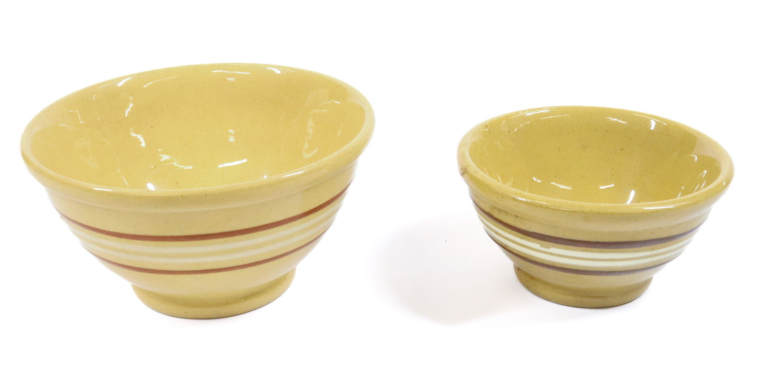 (2) YELLOWARE BOWLS: MATCHING BROWN AND WHITE RINGS 3 1/4" X 6", 2 1/2" X 4 3/4" TERMS: UPDATED 2023 TERMS FOR PURCHASING AND SHIPPING OF AUCTION ITEMS. PLEASE READ CAREFULLY BEFORE BIDDING. ALL PAYMENTS FOR PURCHASES WIL
