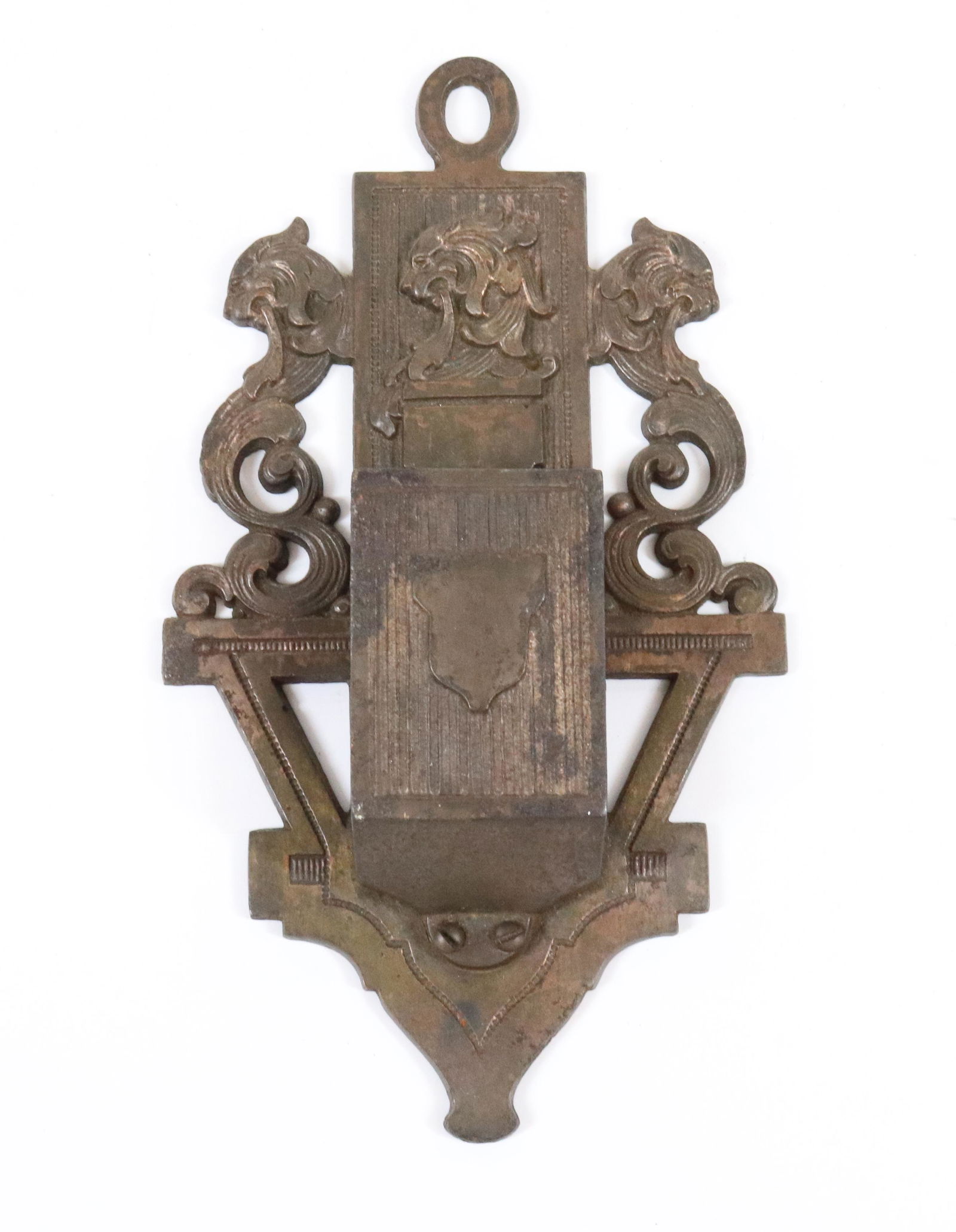 CAST IRON MATCH HOLDER: LION AND SHIELD MOTIF. 7 1/4" L. TERMS: UPDATED 2023 TERMS FOR PURCHASING AND SHIPPING OF AUCTION ITEMS. PLEASE READ CAREFULLY BEFORE BIDDING. ALL PAYMENTS FOR PURCHASES WILL BE MADE THROUGH LIVEAUCTI