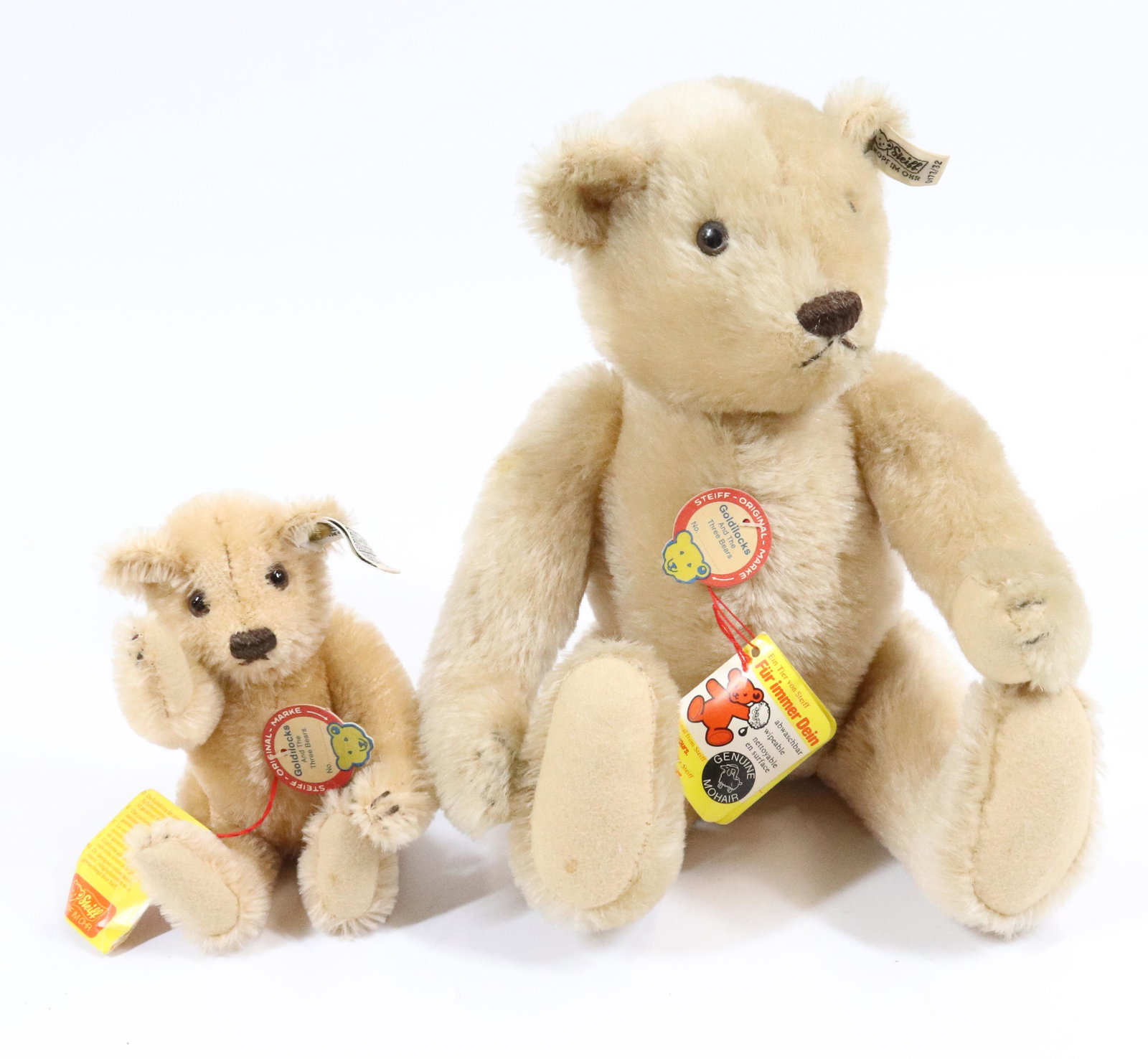 (2) STEIFF GOLDILOCKS BEARS: BUTTON/TAGS IN EAR. PAPER TAGS. 7" AND 12 1/2" LENGTHS. LARGER IS A GROWLER.