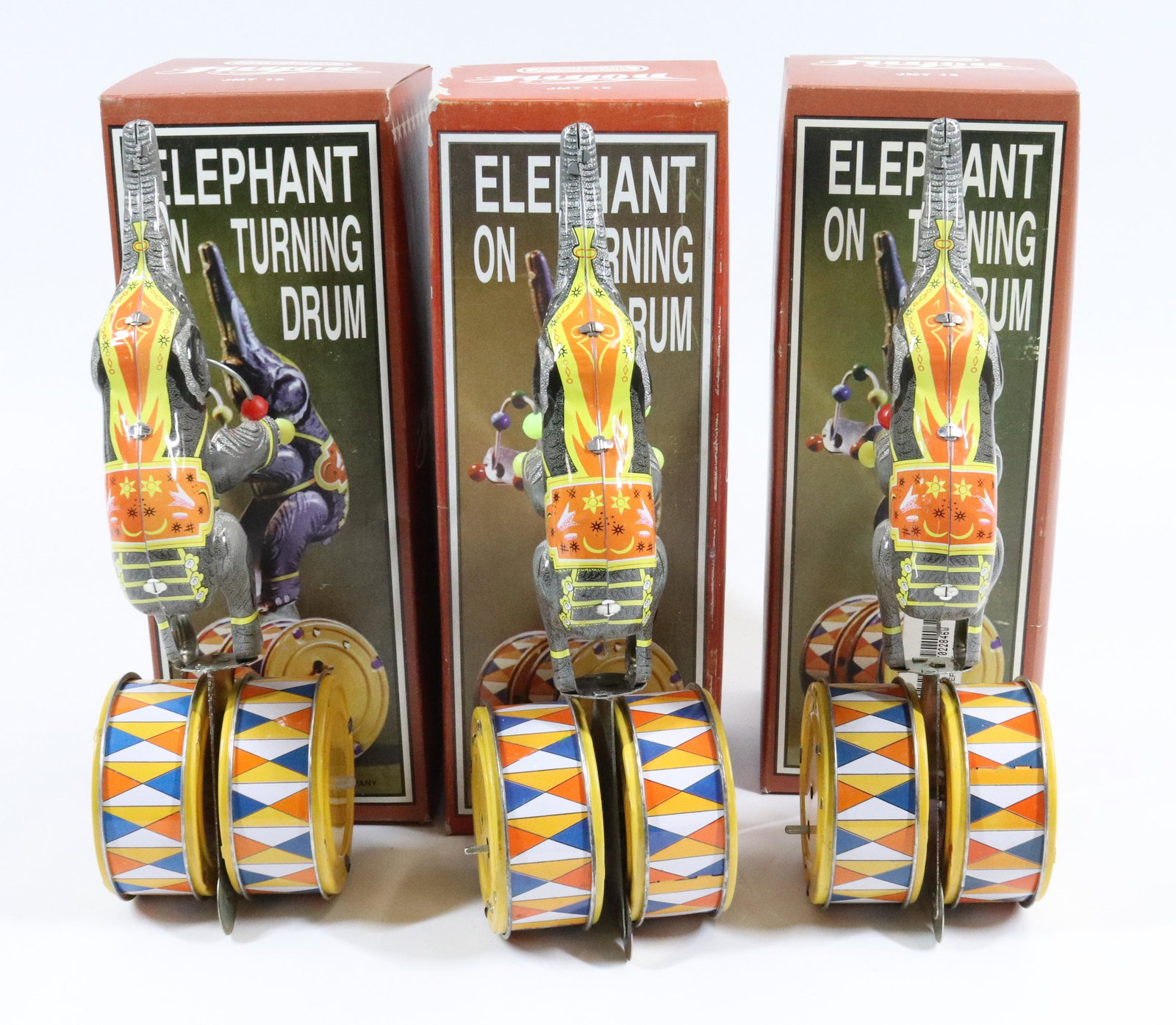 (3) TIN WIND-UP ELEPHANTS ON DRUMS: NEW IN BOX. TIN LITHO WITH KEY.