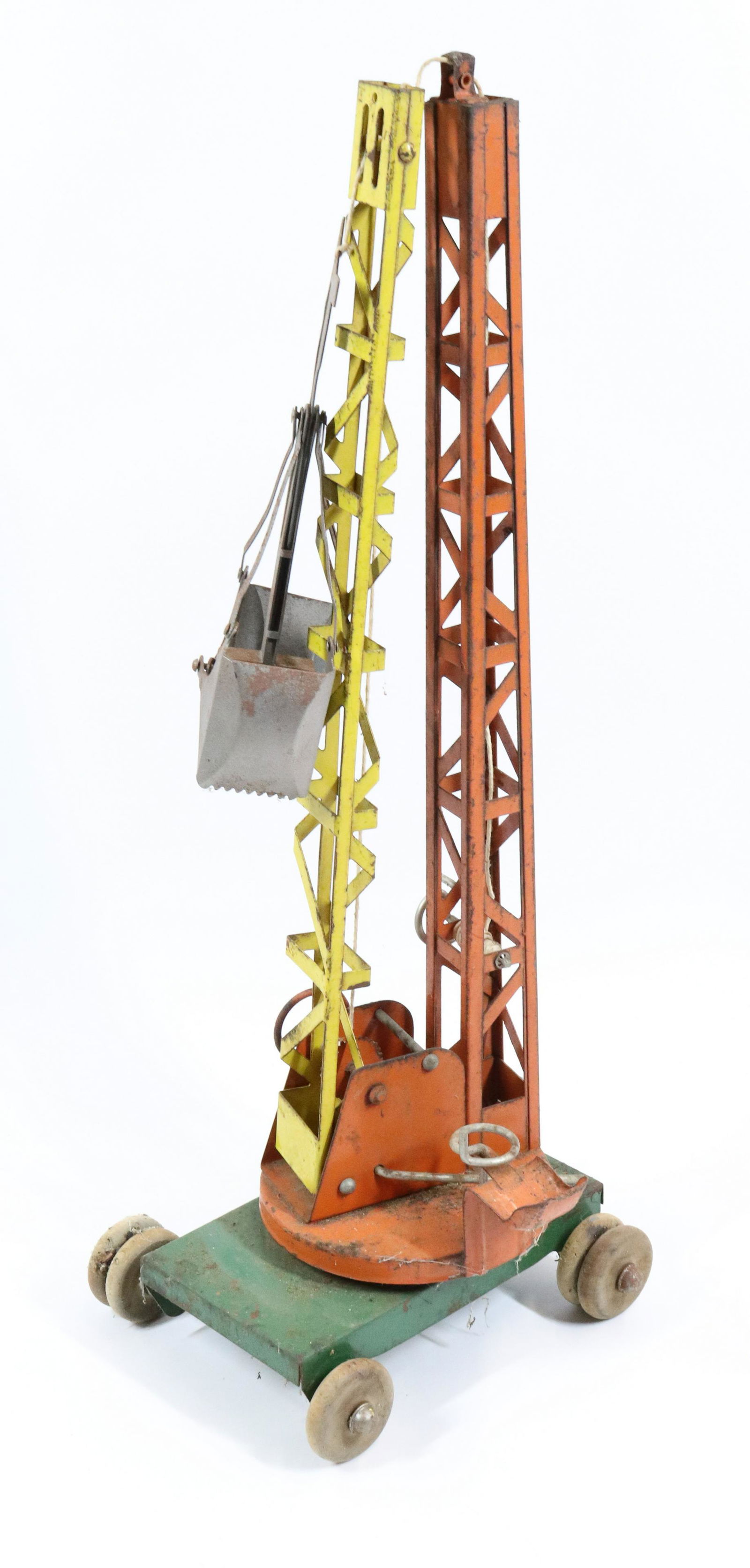 BUDDY L PRESSED STEEL CONSTRUCTION CRANE: ORANGE/YELLOW/GREEN PAINT. WOODEN WHEELS. 8" X 24" H.