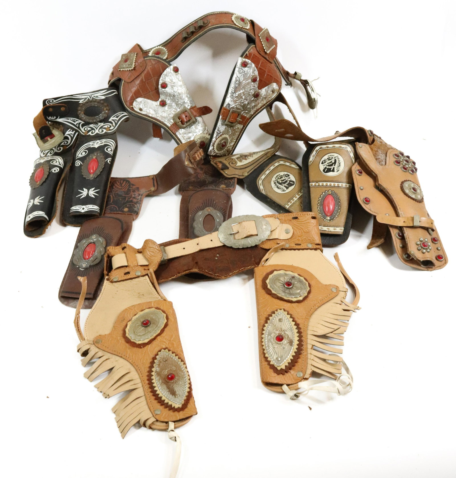 LOT OF TOY CAP GUN HOLSTERS: VARIOUS STYLES AND SIZES. ONE MRKD. TOP GUN.