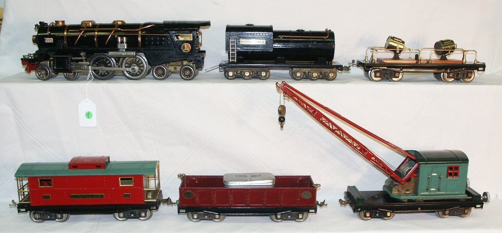 LIONEL PRE-WAR STANDARD GAUGE WORK TRAIN 400E BL: LIONEL PRE-WAR STANDARD GAUGE WORK TRAIN 400E BLACK, 400T TENDER, 220 TERRA COTTA, BRASS SEARCH LIGHT CAR, 219 GREEN CRANE, 212 MAROON GONDOLA, AND 217 RED & PEACOCK GREEN CABOOSE ENGINE HAS MIXED TRI